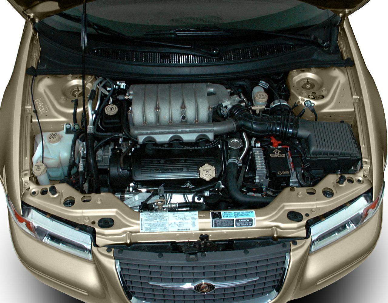 Open engine bay with visible air intake, battery, and coolant reservoir.