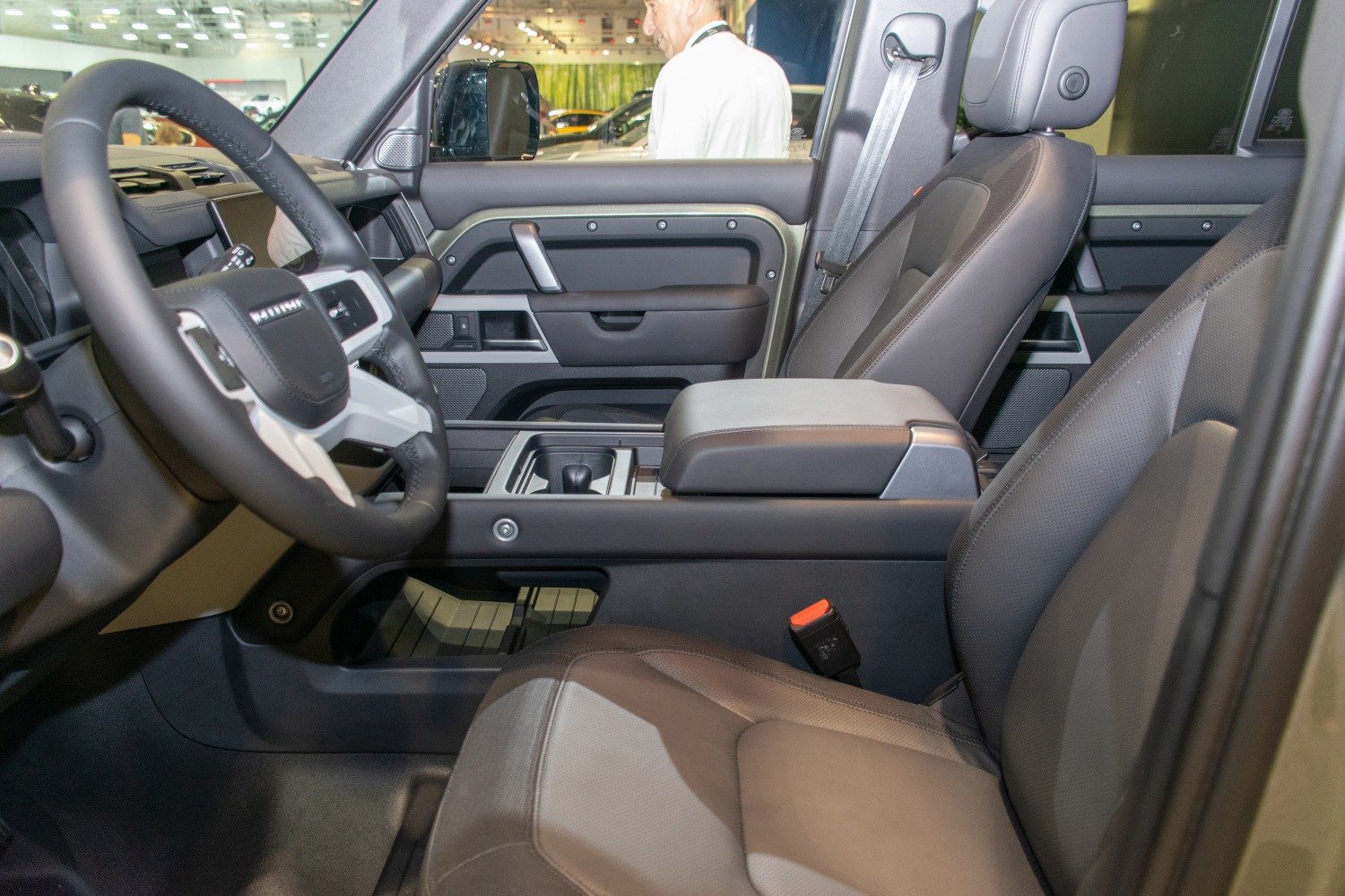 Spacious luxury SUV interior with modern controls and leather seating