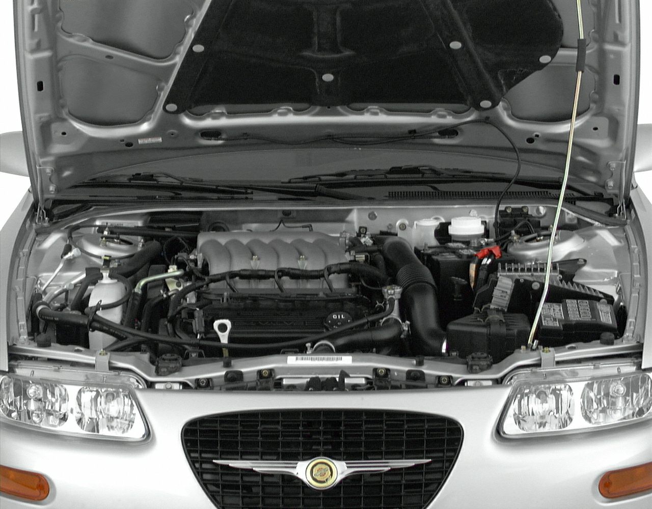 Open hood showing 1994 Chrysler Sebring Coupe engine bay and components