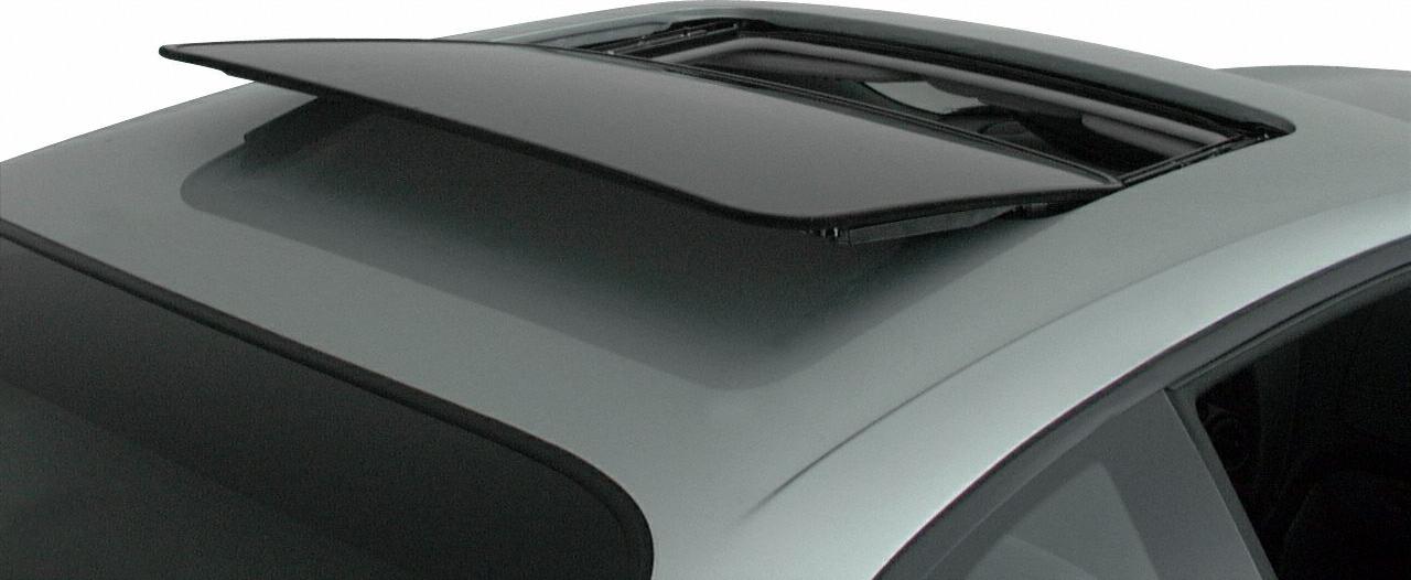 Open pop-up sunroof on car roof edge