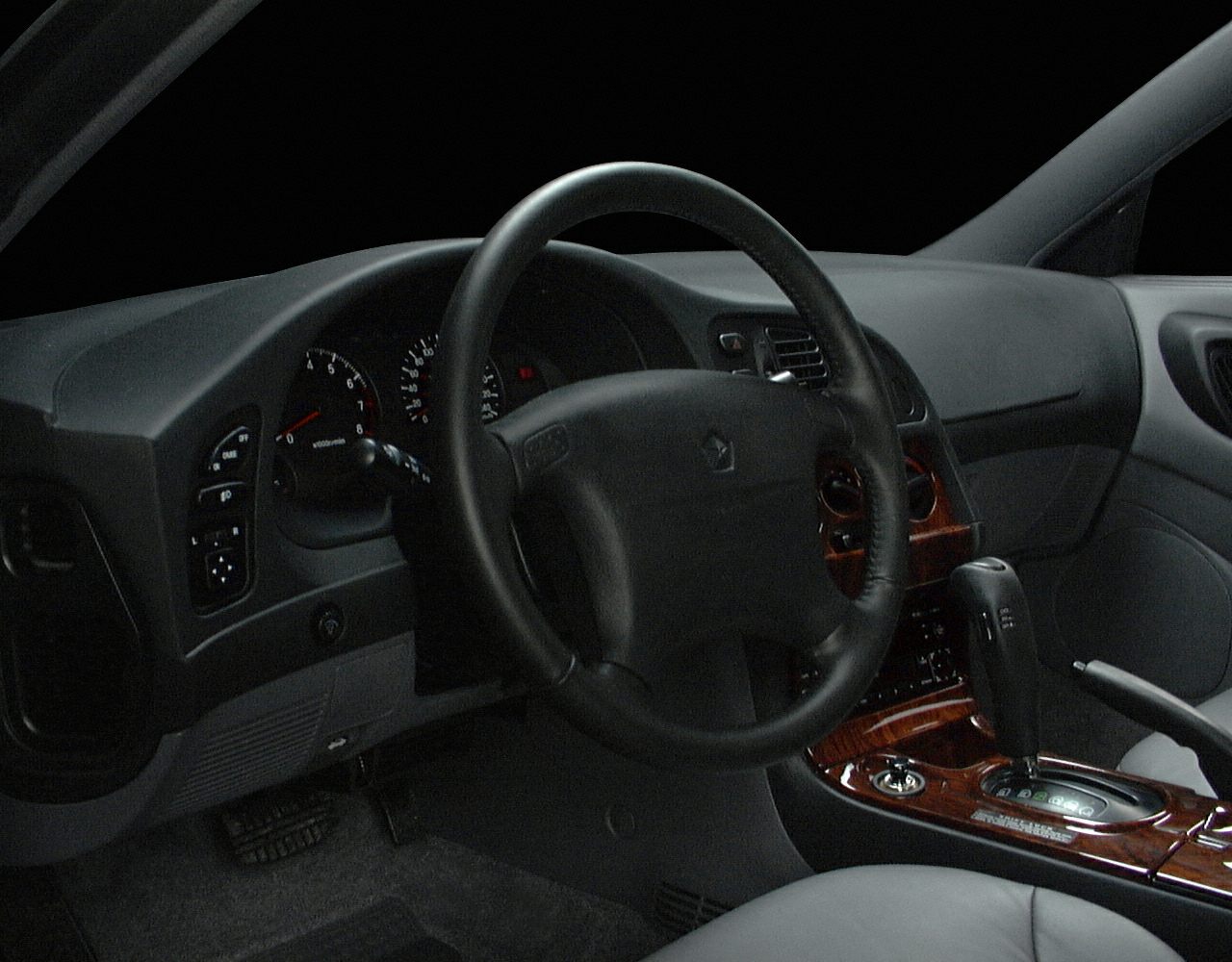 Steering wheel and dashboard with automatic gear shift and wood trim