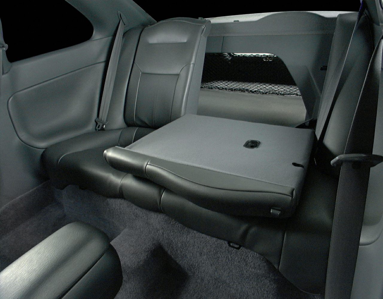 Fold-down rear seat with upholstery and seatbelt details