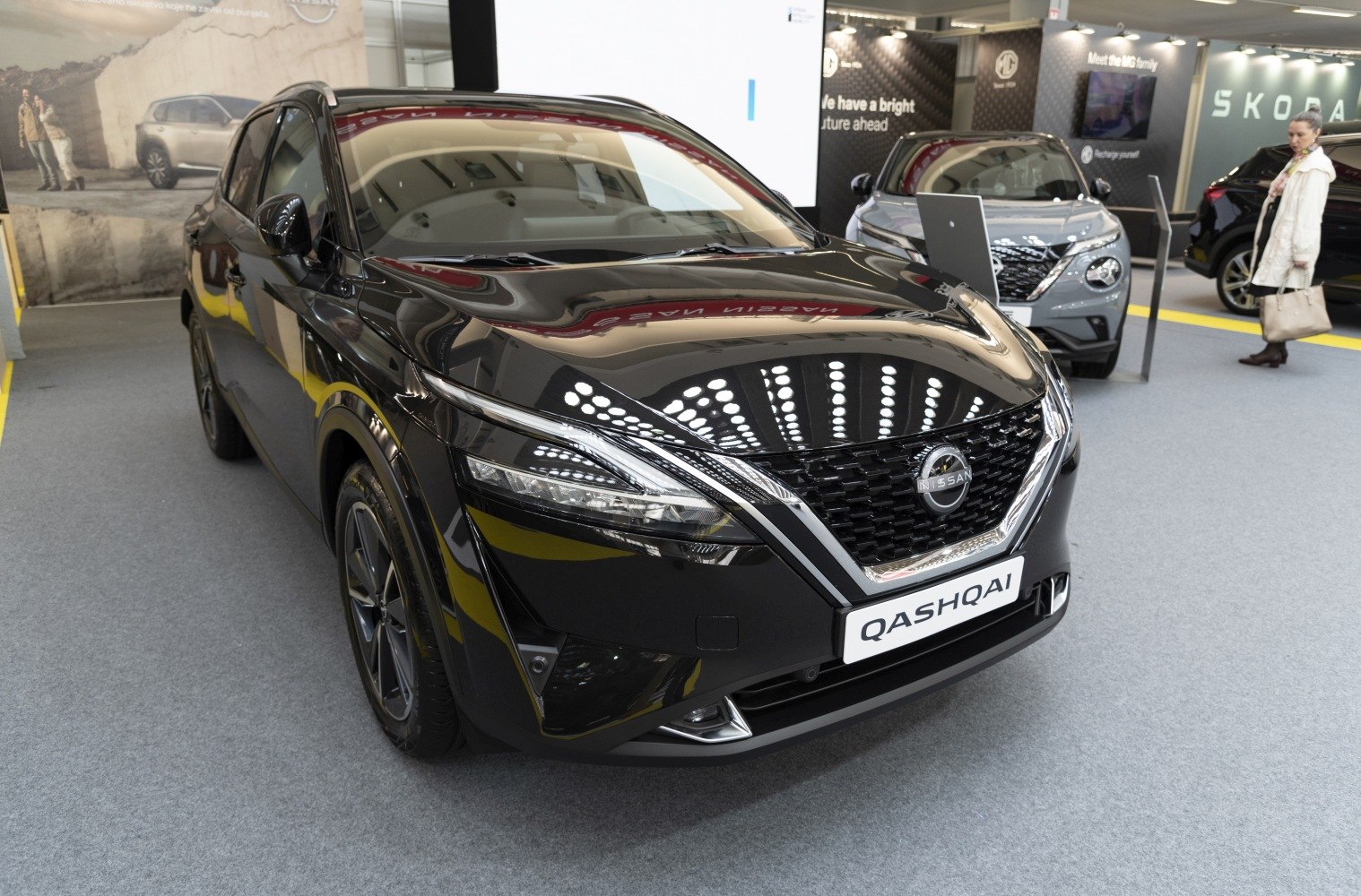 Front view of black SUV with modern grille and sharp headlights
