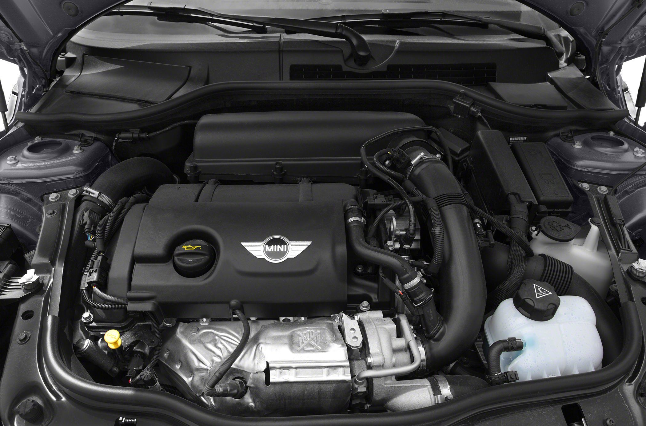 Close-up of compact engine bay with modern components and Mini emblem
