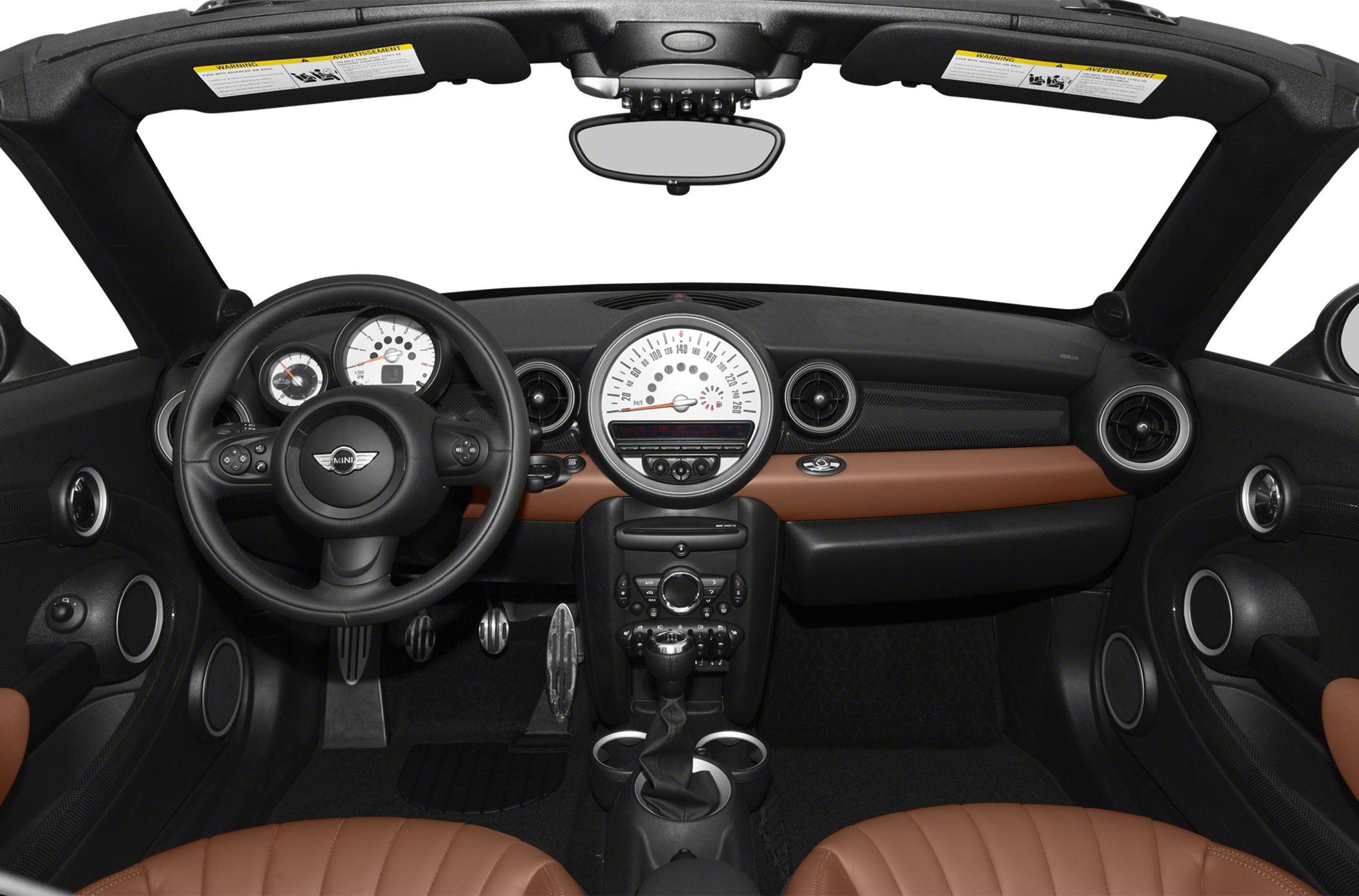 Dashboard, steering wheel, and tan leather seats of convertible car interior