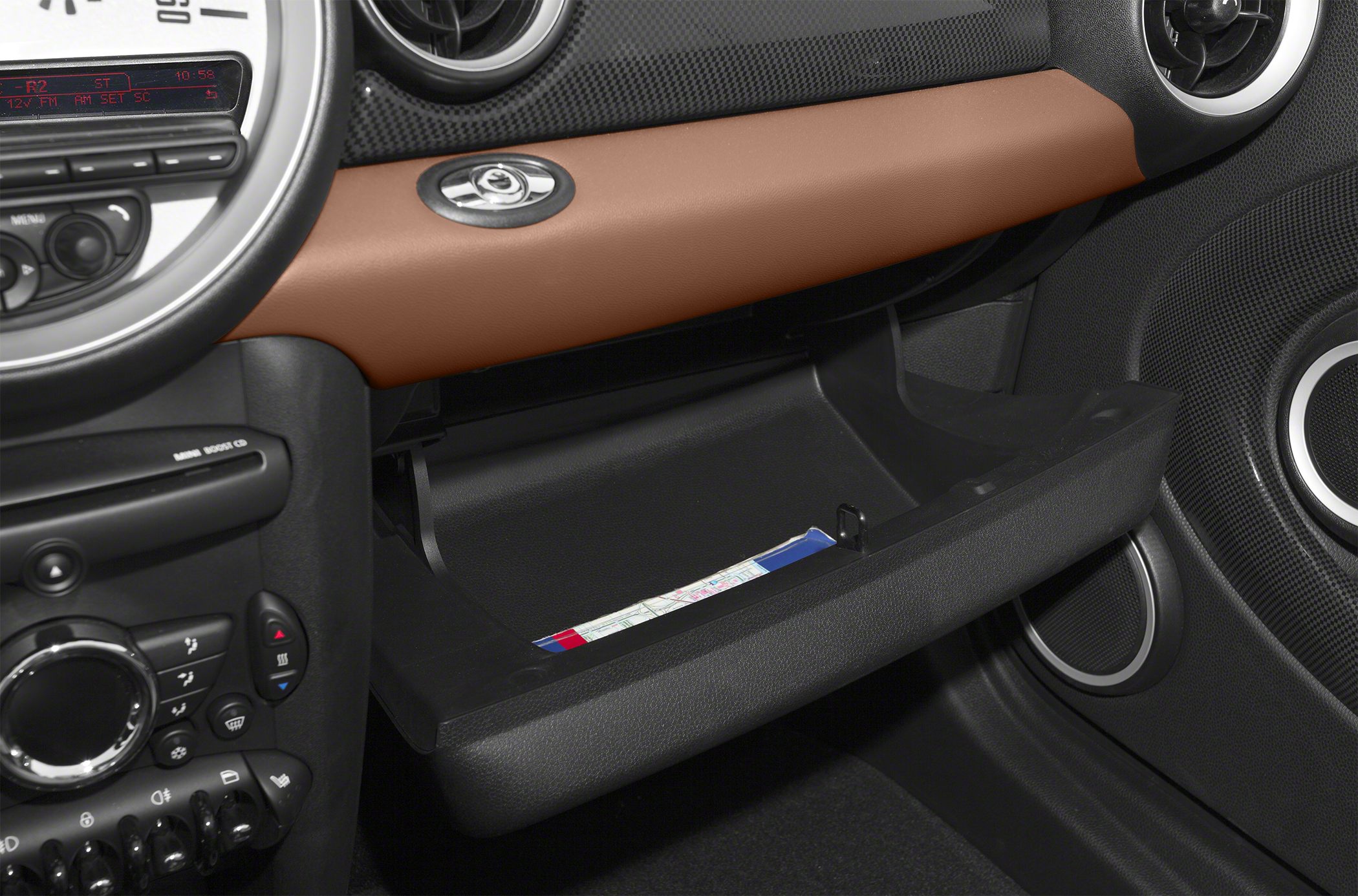 Open glove box with dashboard and control panel in car interior