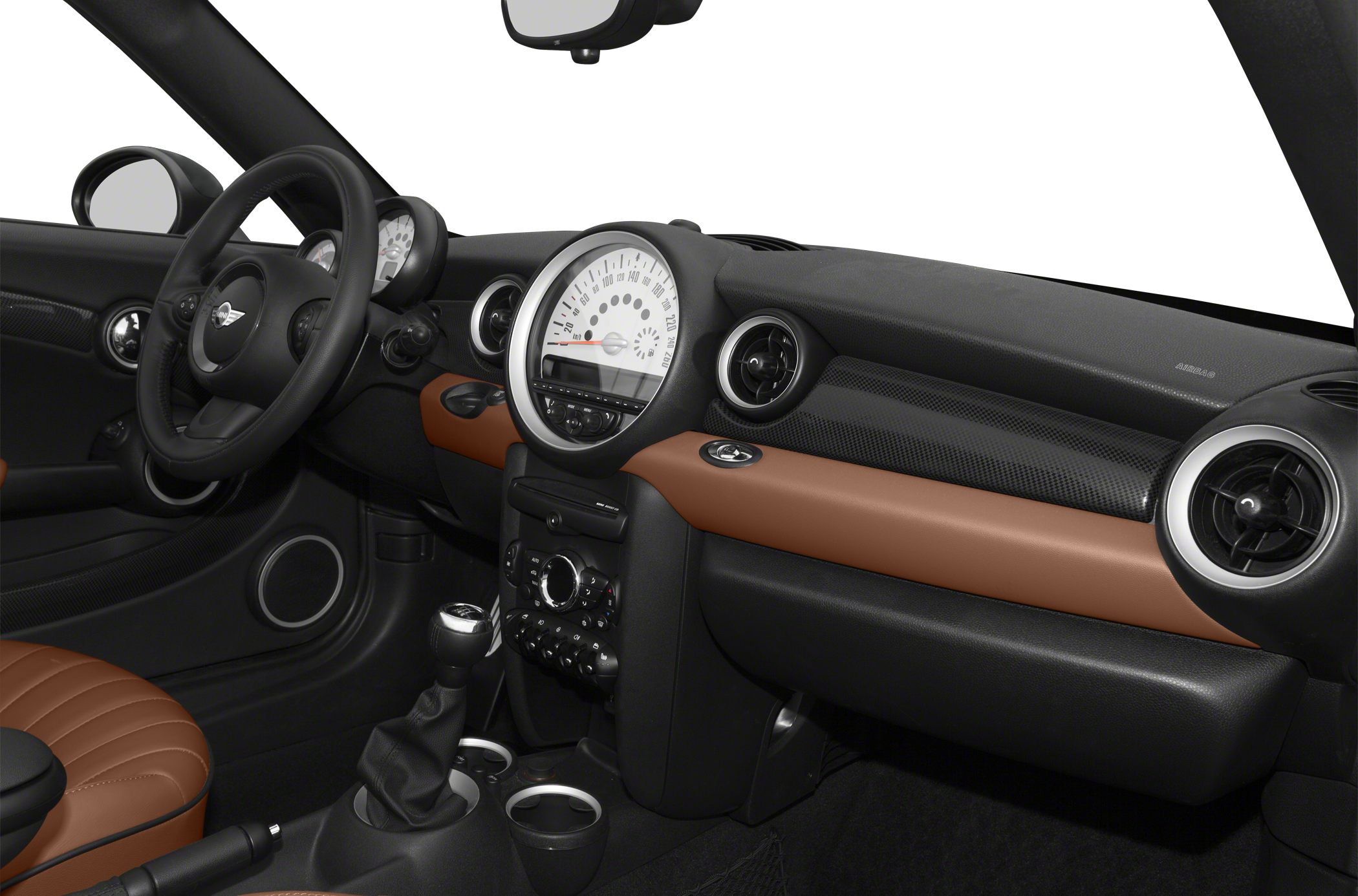 Dashboard with large speedometer, steering wheel, manual gear shift, and two-tone interior trim