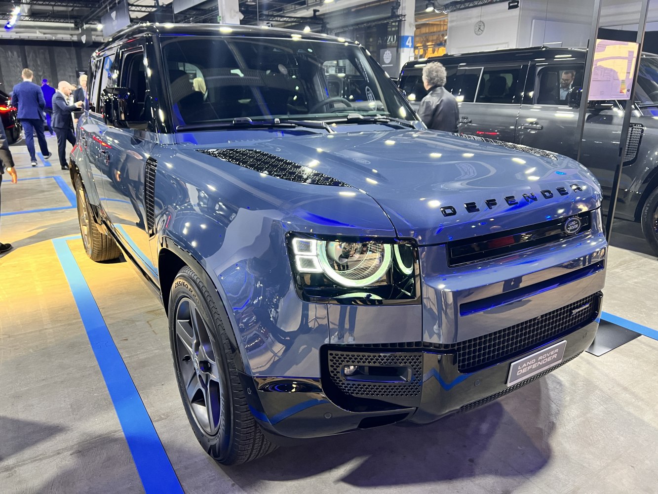 Front view with distinctive LED headlights and bold grille design