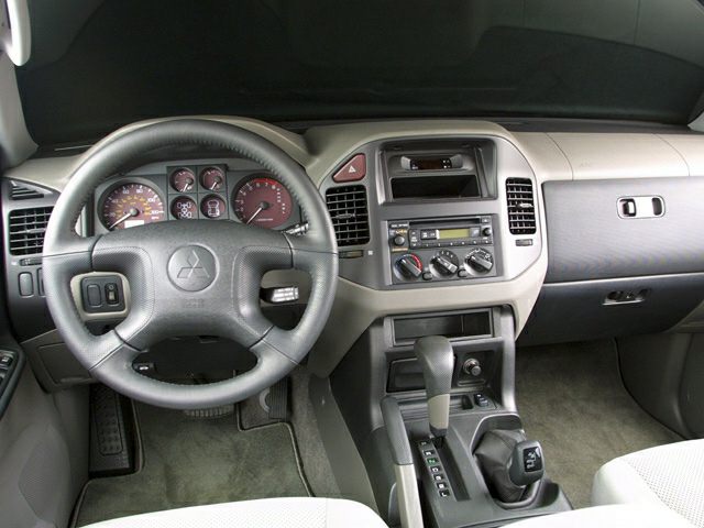 Dashboard and steering wheel with center console of a classic SUV interior