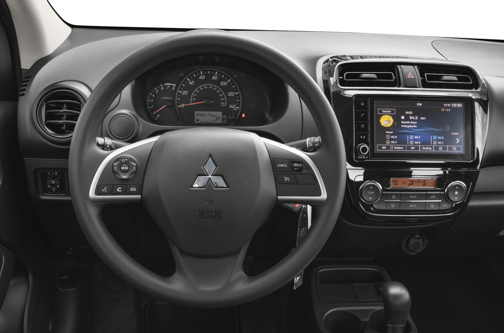Steering wheel with controls, instrument cluster, infotainment touchscreen, climate control panel