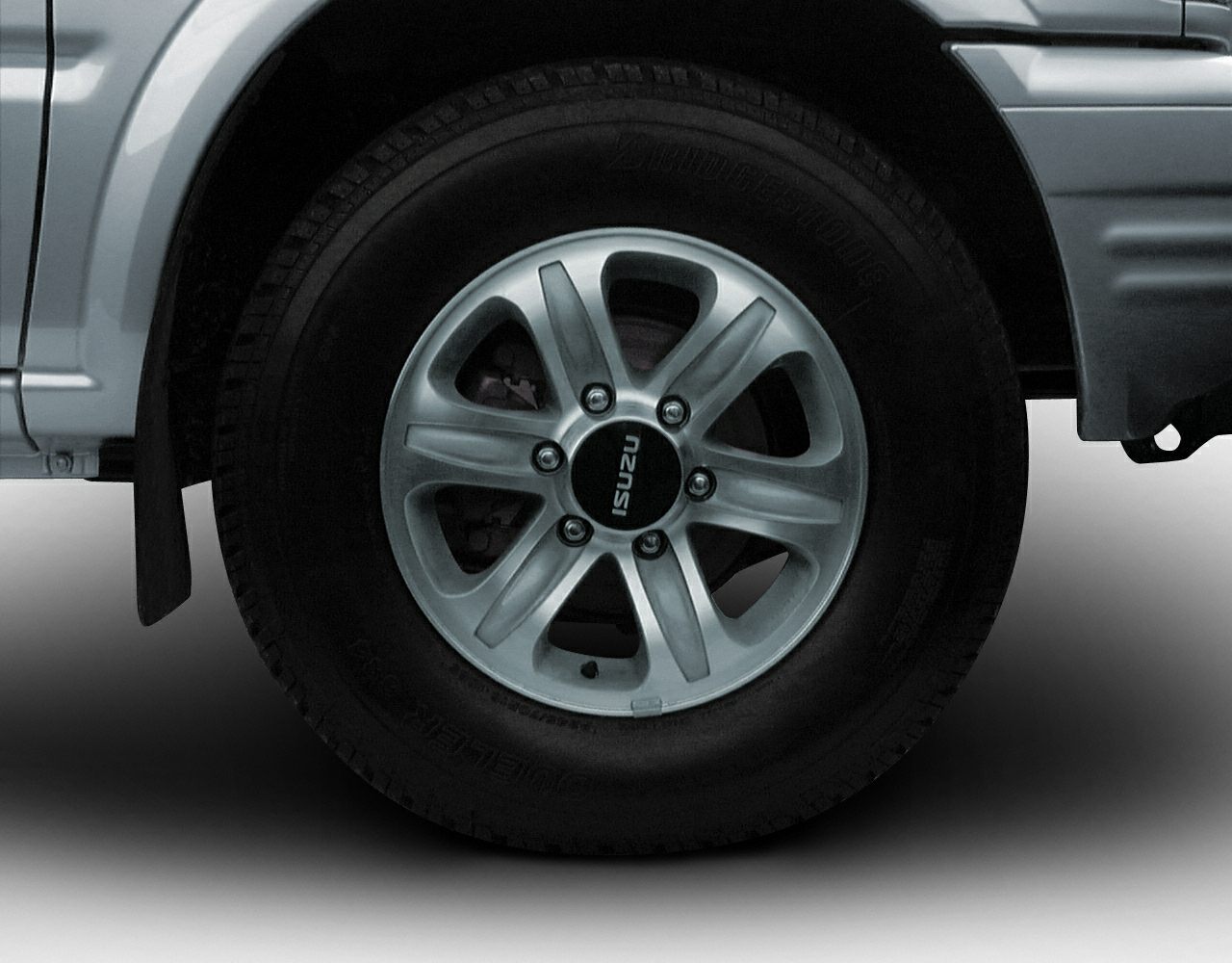 Close-up of alloy wheel rim and tire on SUV