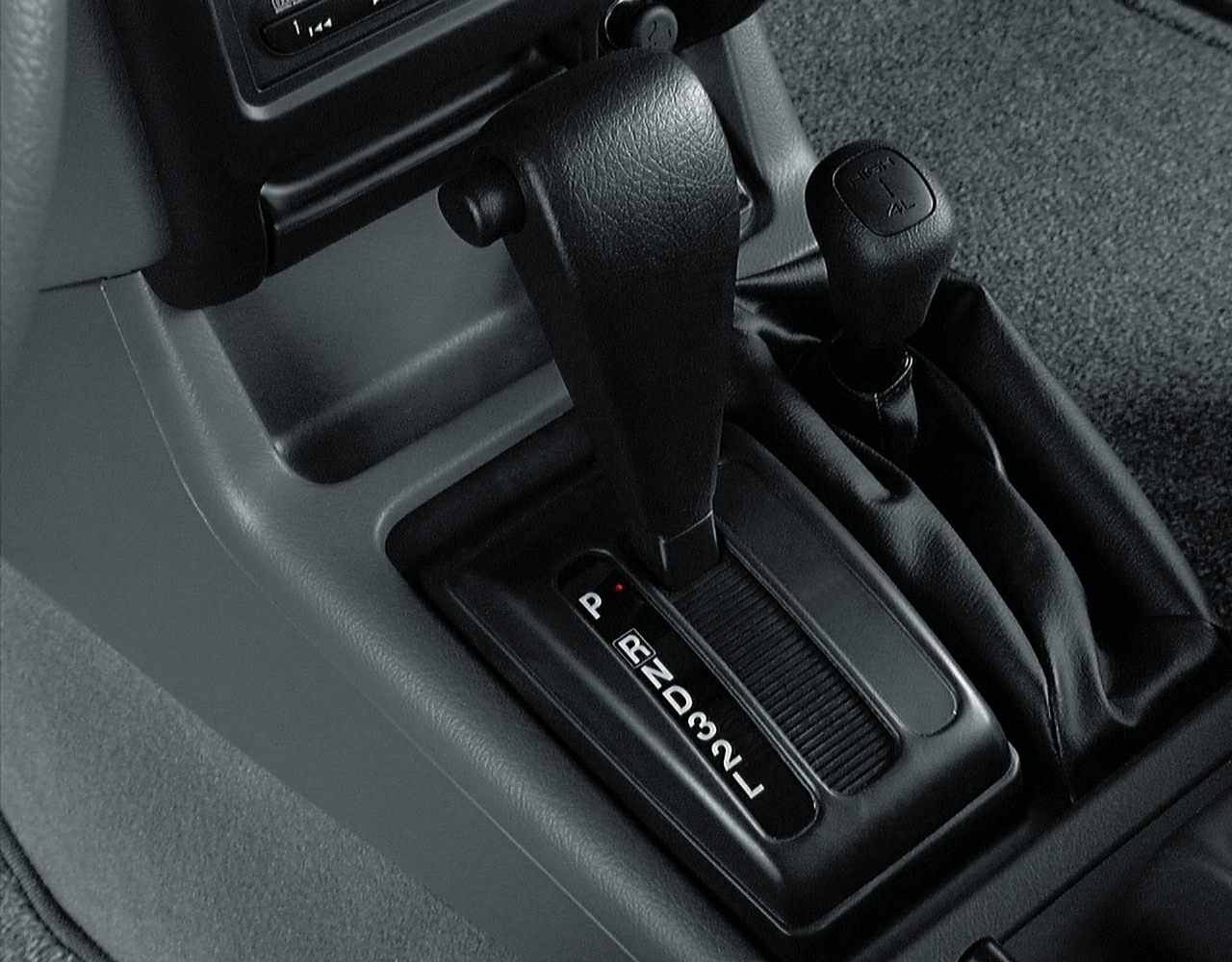 Automatic gear shift and 4WD transfer lever in vehicle interior