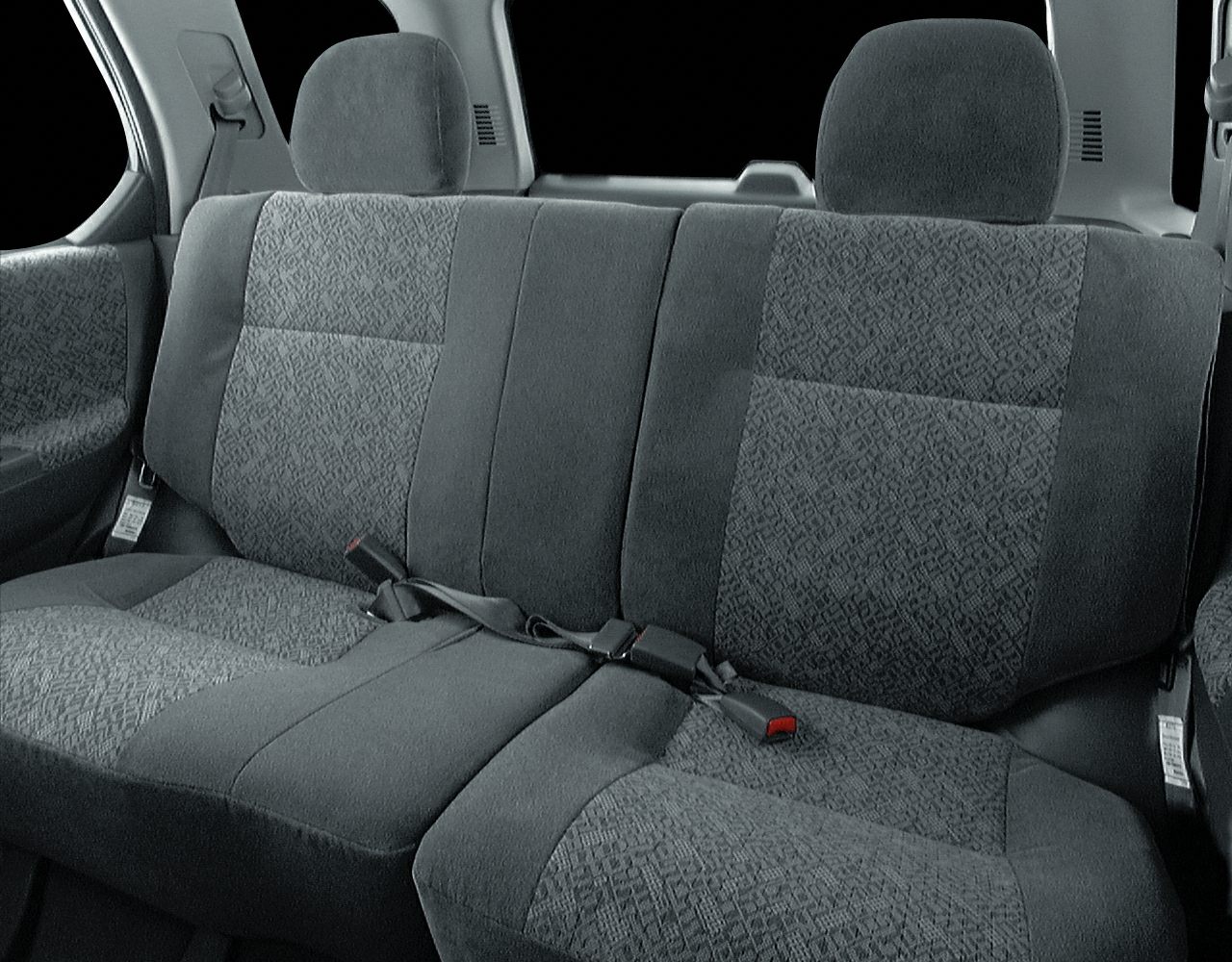 Rear seat upholstery with patterned fabric and headrests