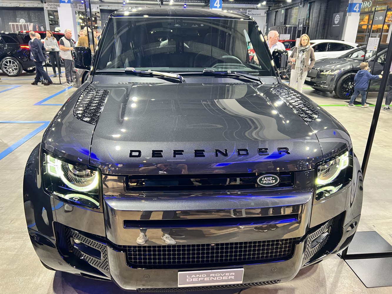 Close-up of SUV front with grille and LED headlights