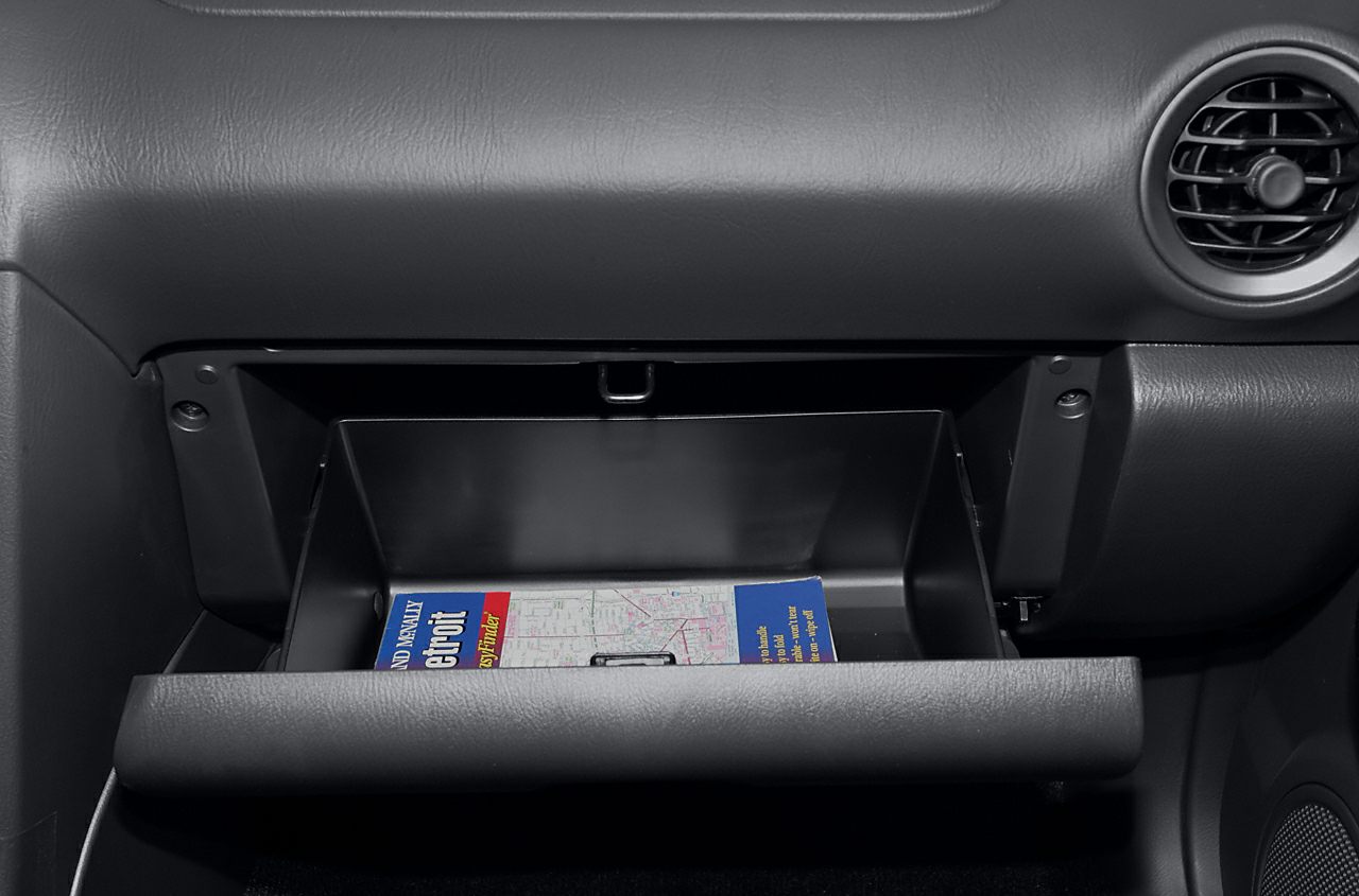 Open glove compartment with map inside
