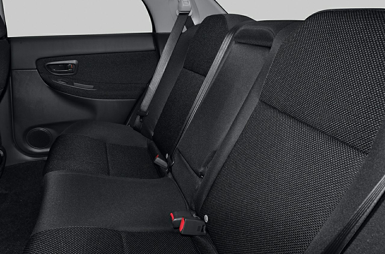Rear seat cloth upholstery and seatbelt inside car door panel