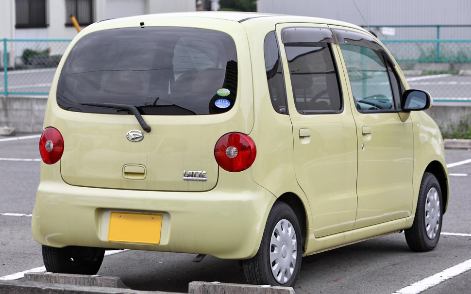 Rear view of compact hatchback with round taillights and simple design.