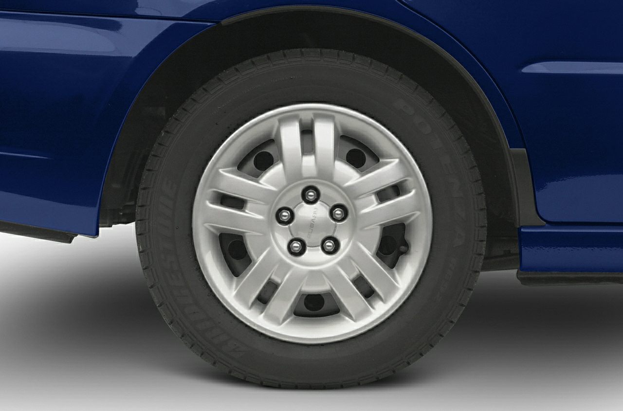 Close-up of aluminum alloy wheel and Bridgestone Potenza tire on vehicle