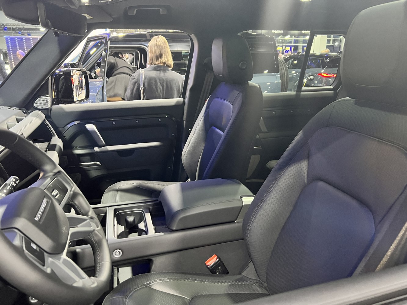 Spacious front seats and modern SUV interior cabin in black leather.