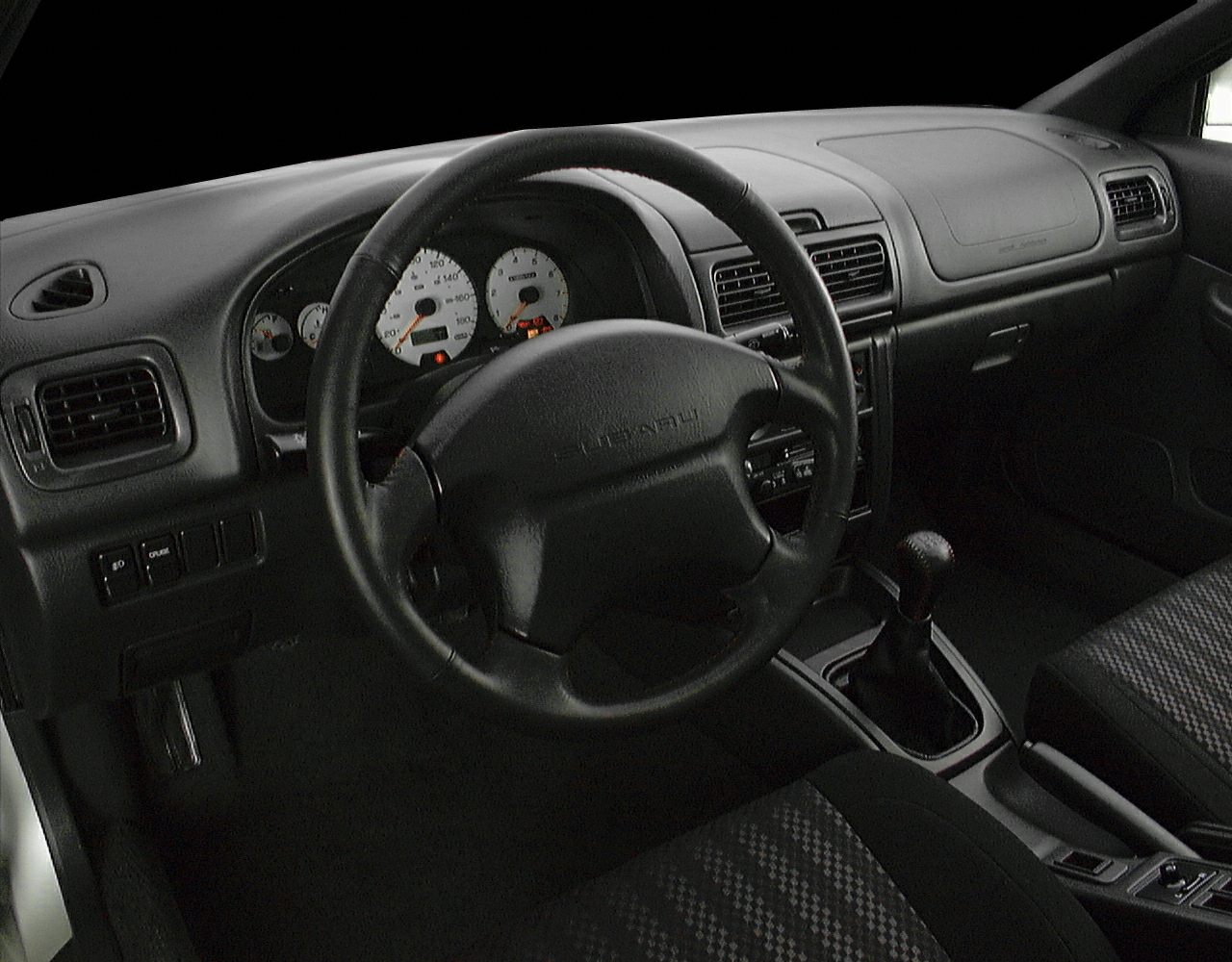 Classic dashboard, steering wheel, and manual gear shift interior design