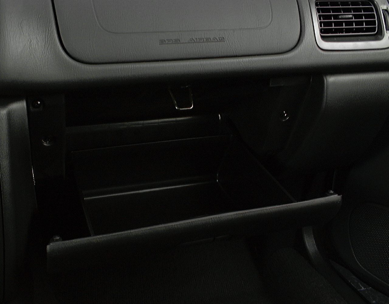Open glove compartment and dashboard interior section