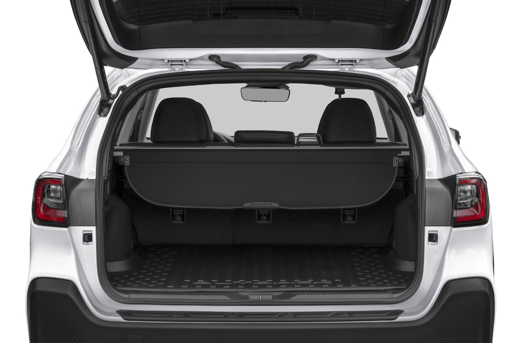 Open rear trunk with cargo area and privacy cover of an SUV.