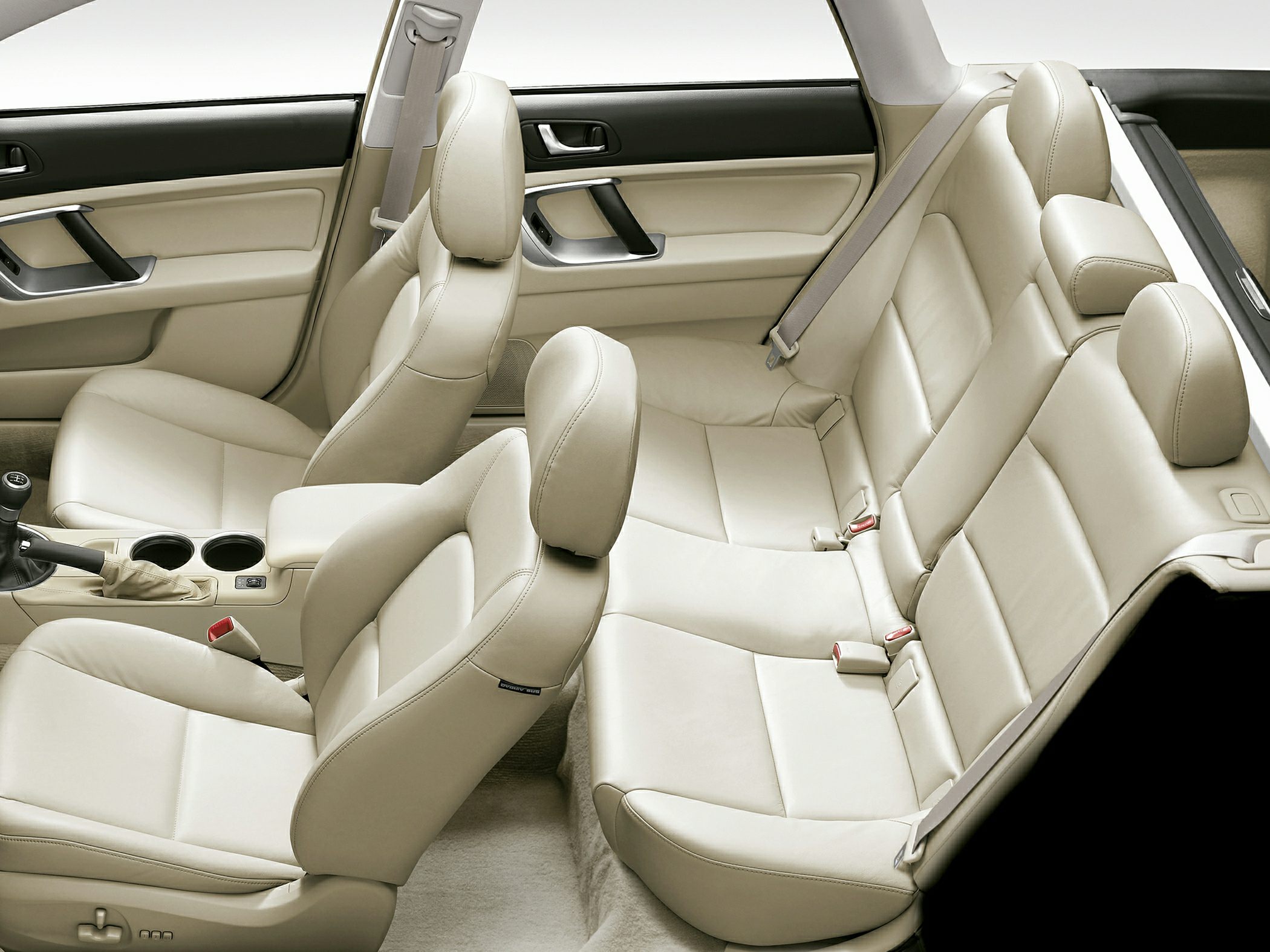 Beige leather front and rear seats with seatbelts and armrest