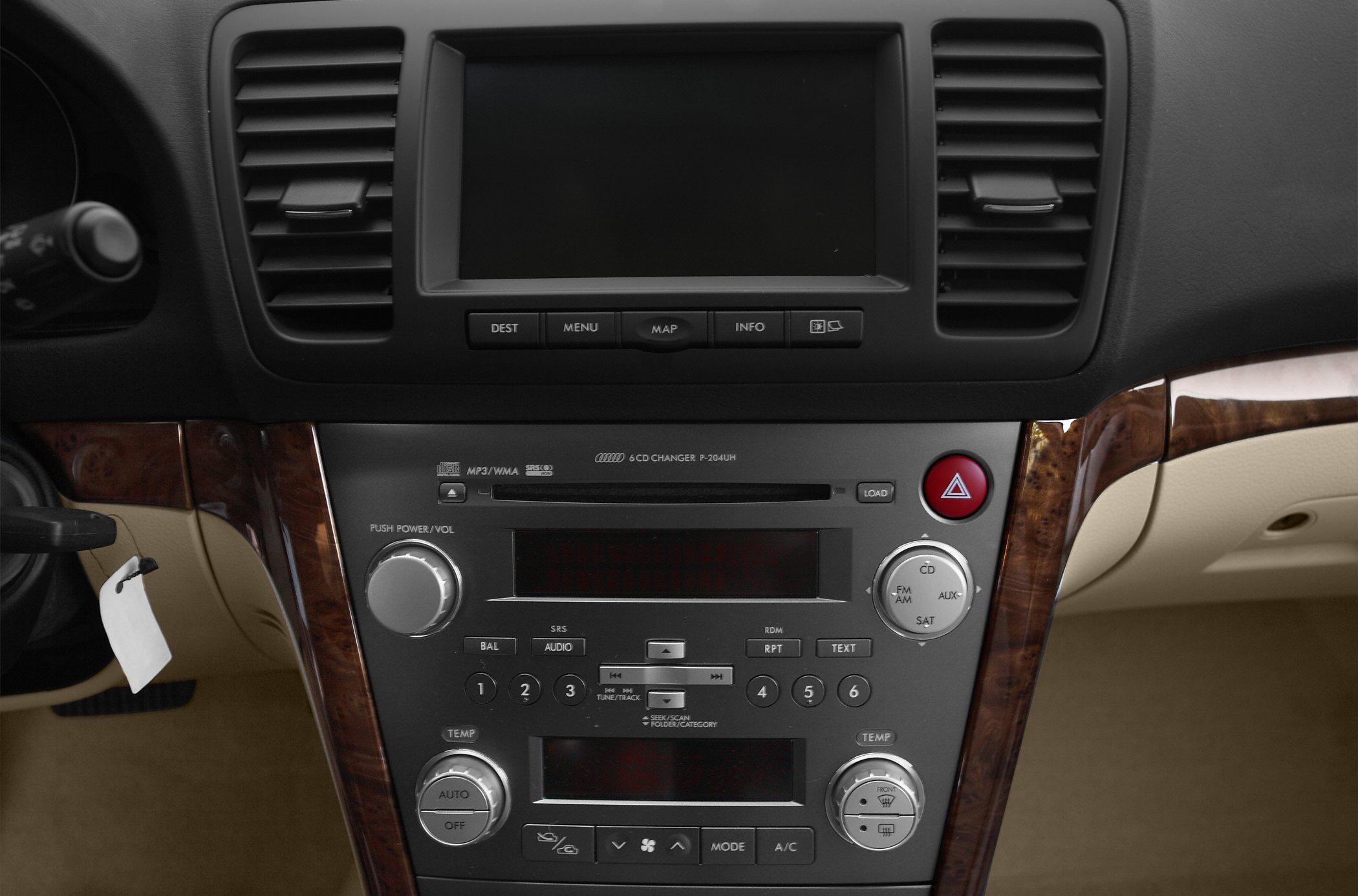Car center console with audio system, climate controls, navigation buttons, and wood trim