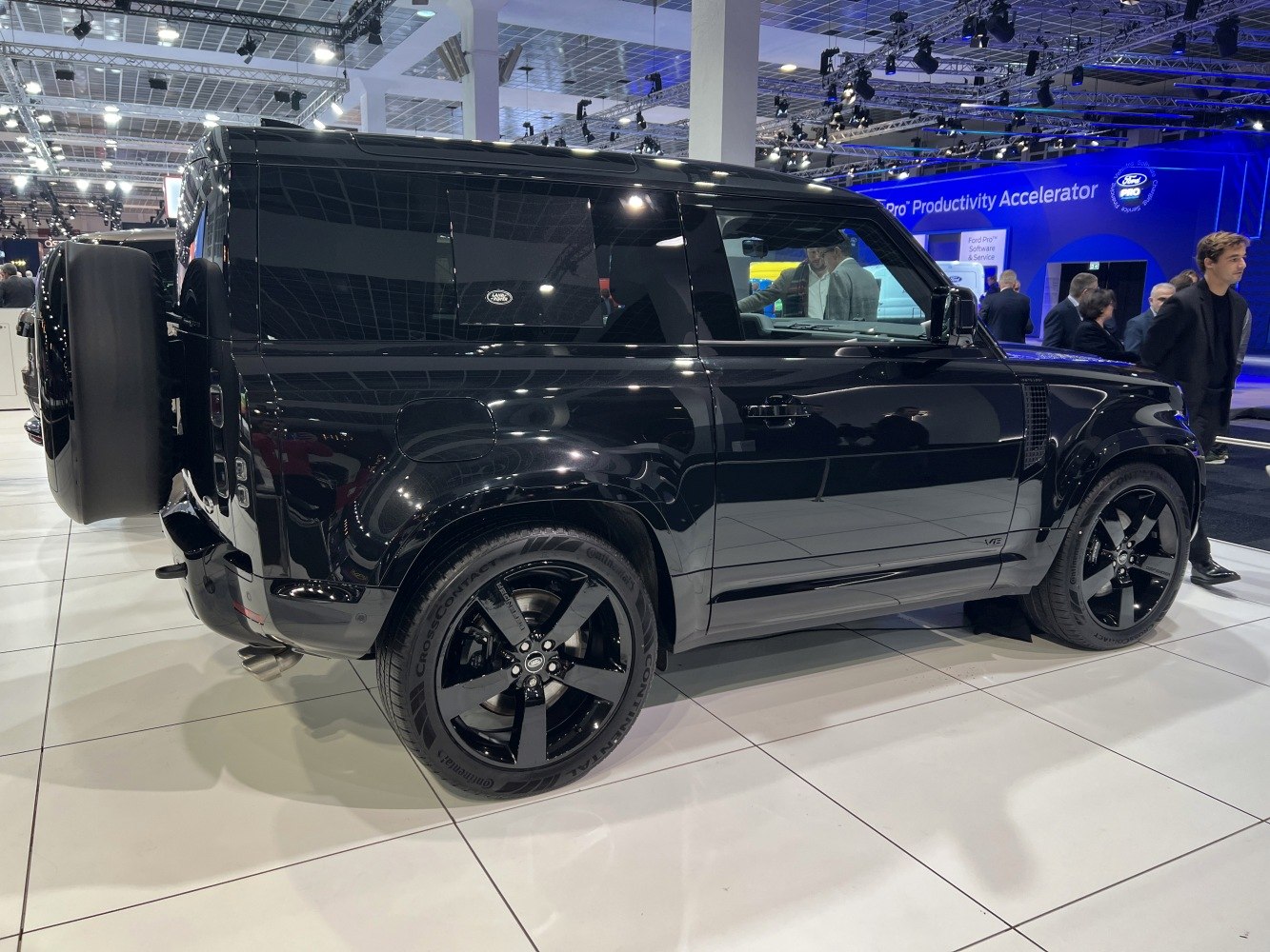 Black SUV side profile with black wheels and rear spare tire
