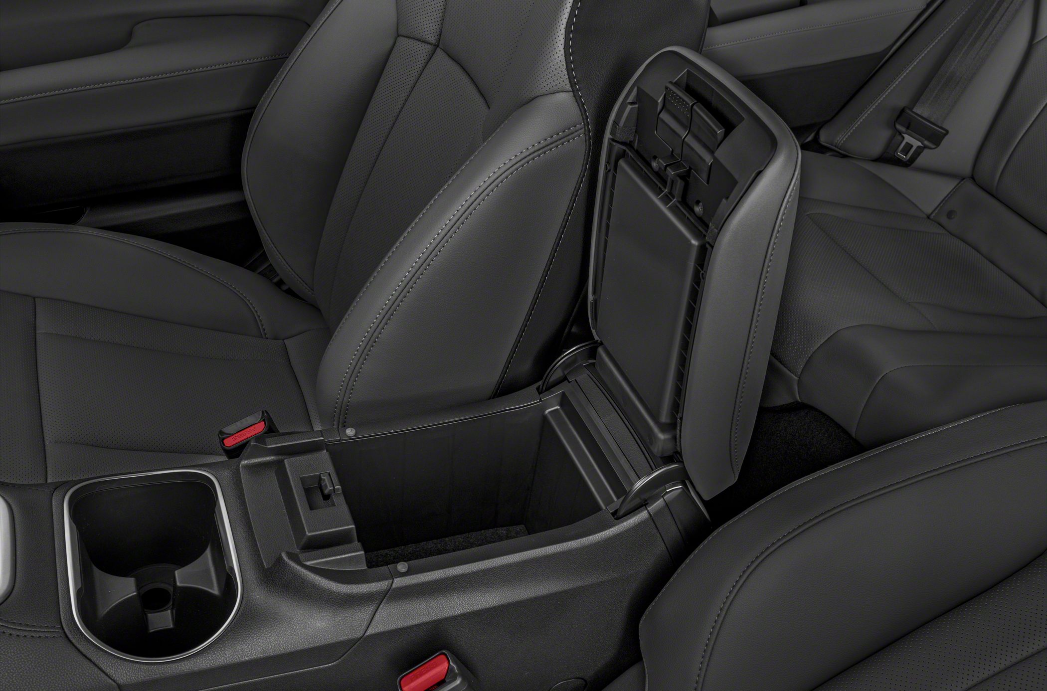 Center console storage with cup holder and leather seat details