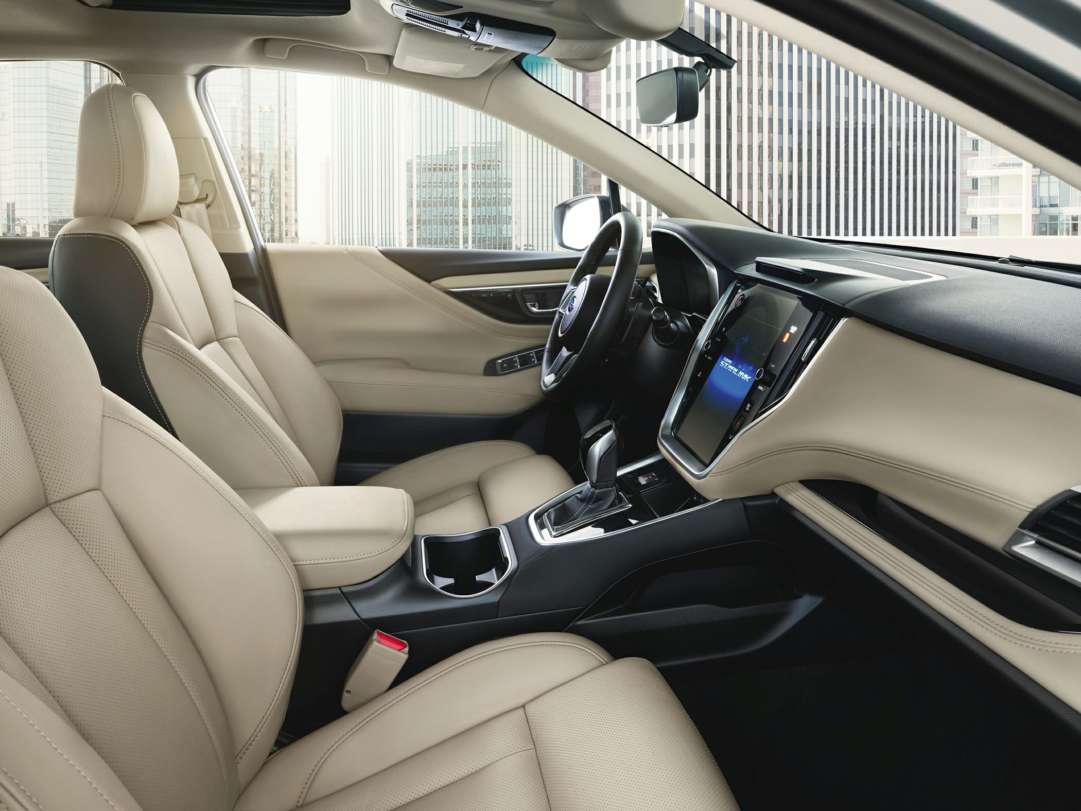 Beige leather seats and touchscreen infotainment system in modern car interior