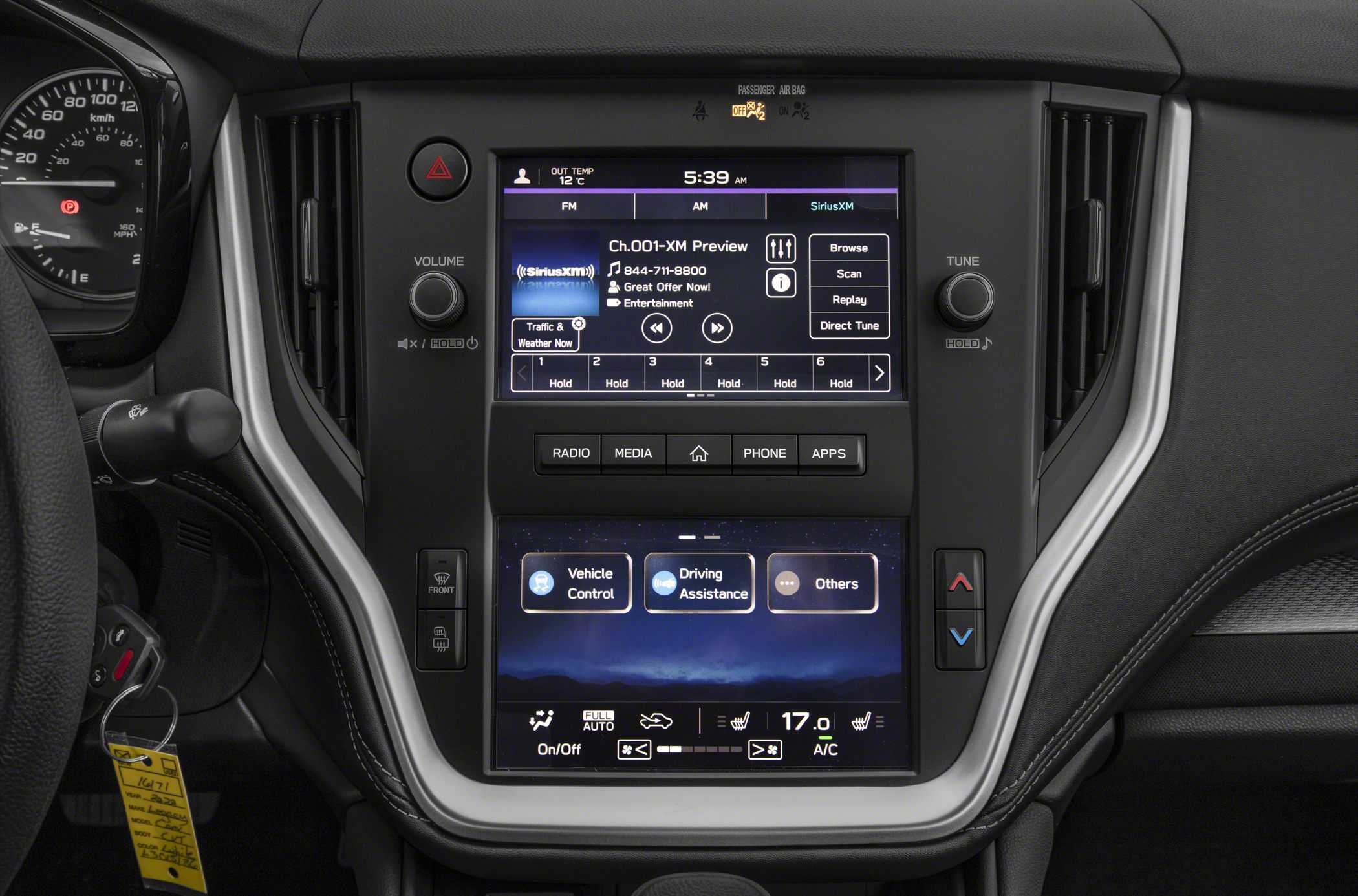 Dual touchscreen multimedia and climate control interface with radio, vehicle control, and driving assistance options