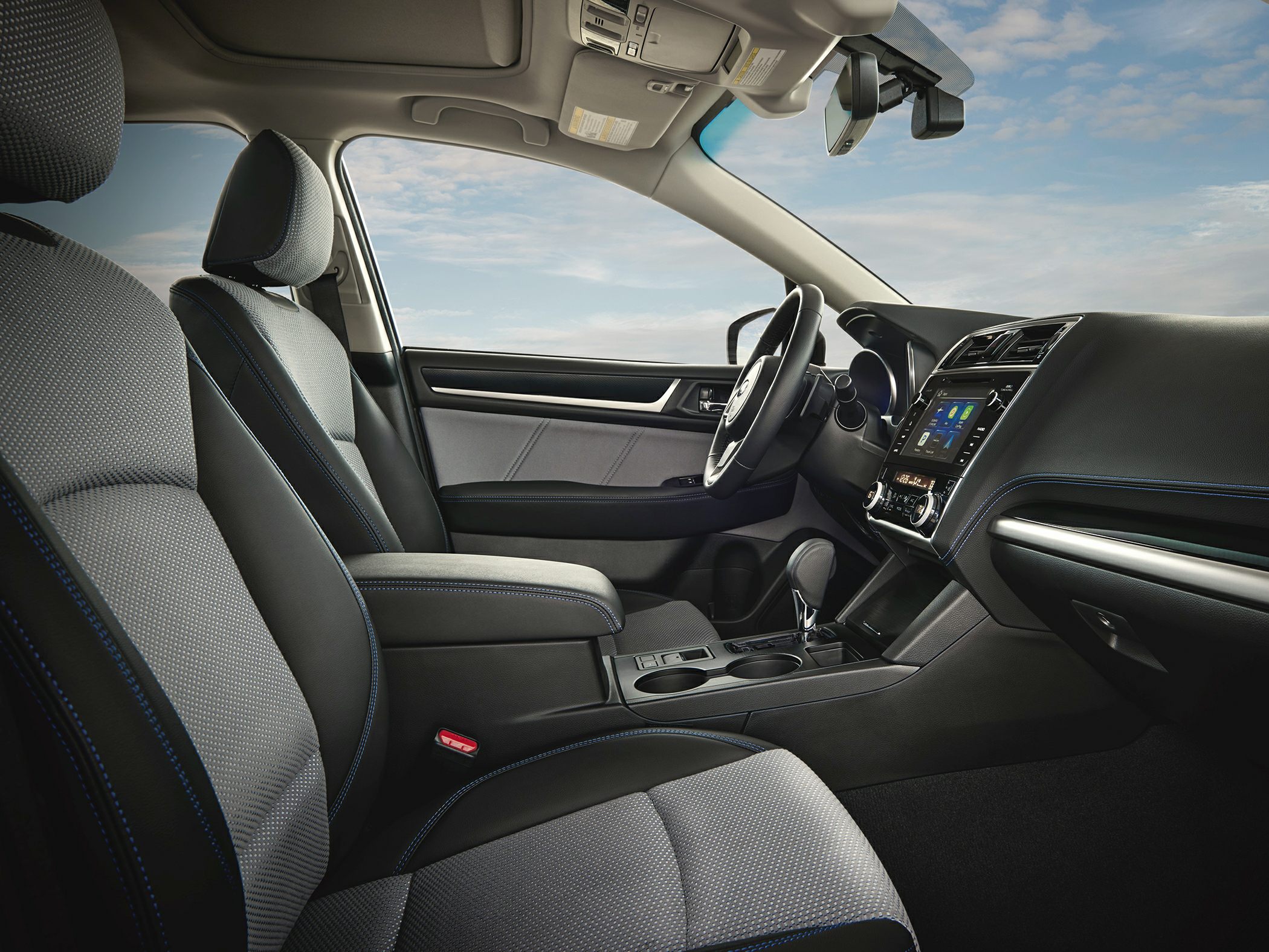 Modern car interior with dashboard and fabric seats