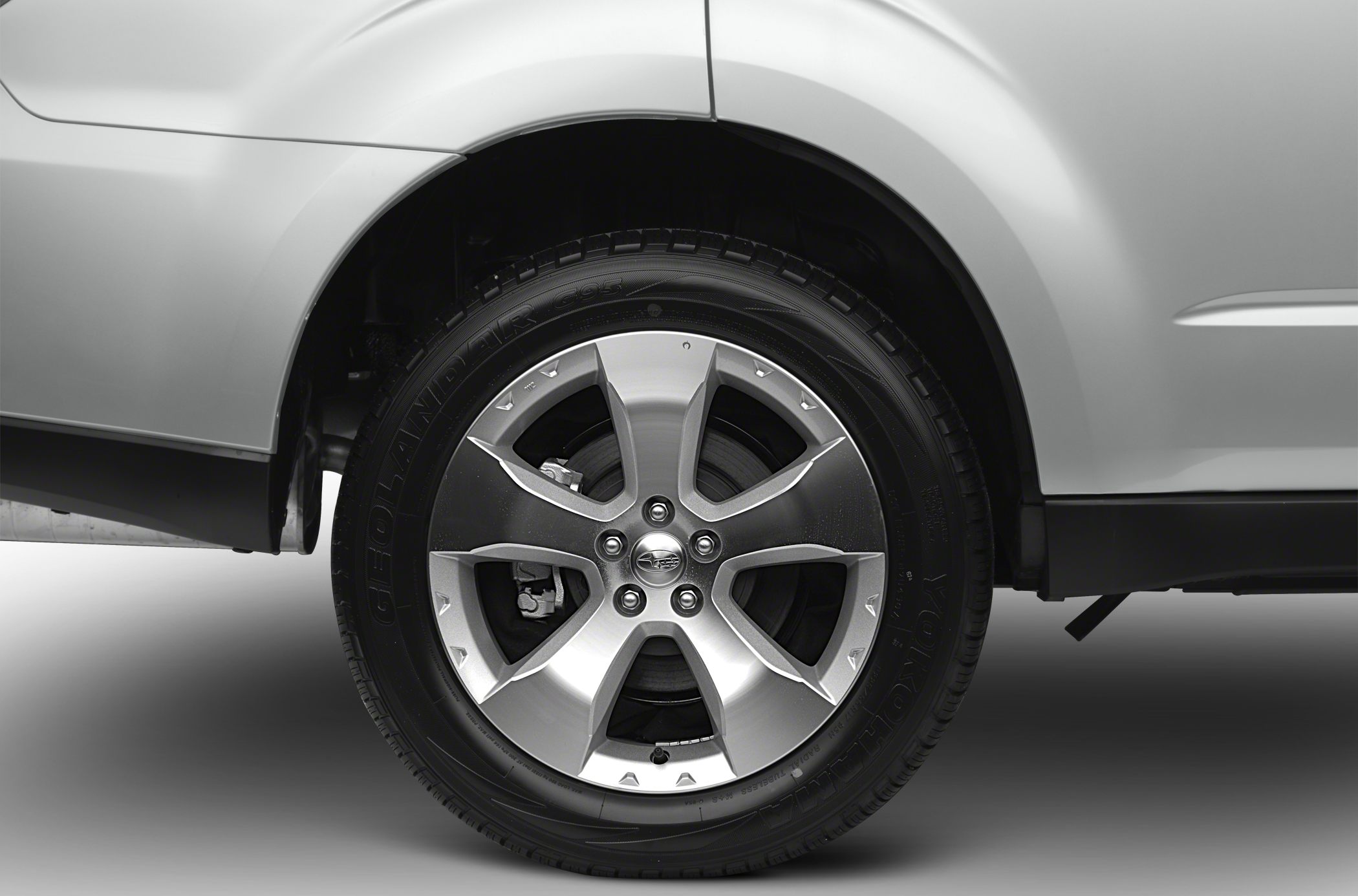 Close-up of alloy wheel and tire with visible brake caliper and rim design