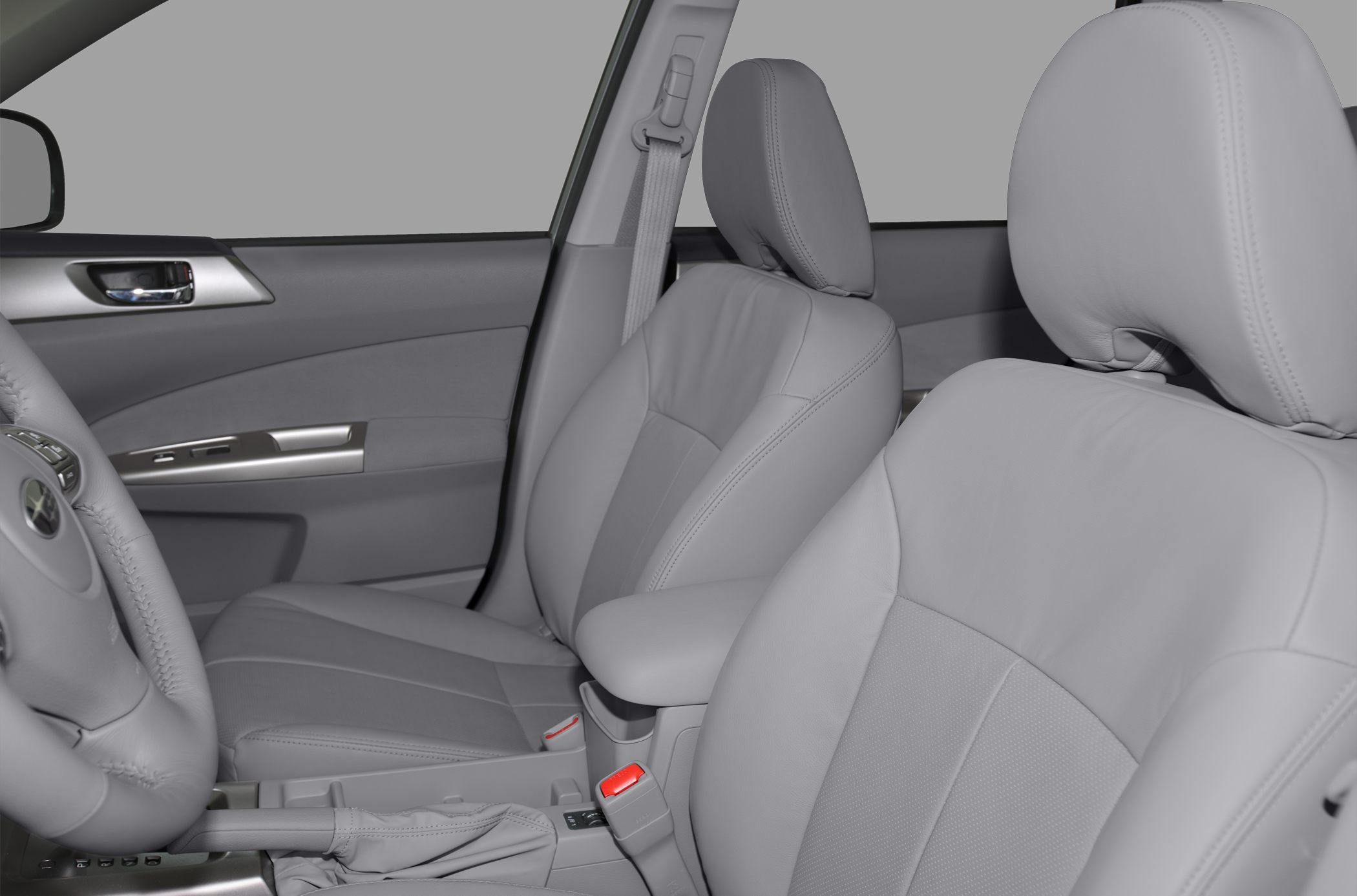 Leather upholstered front seats and door panel inside vehicle.