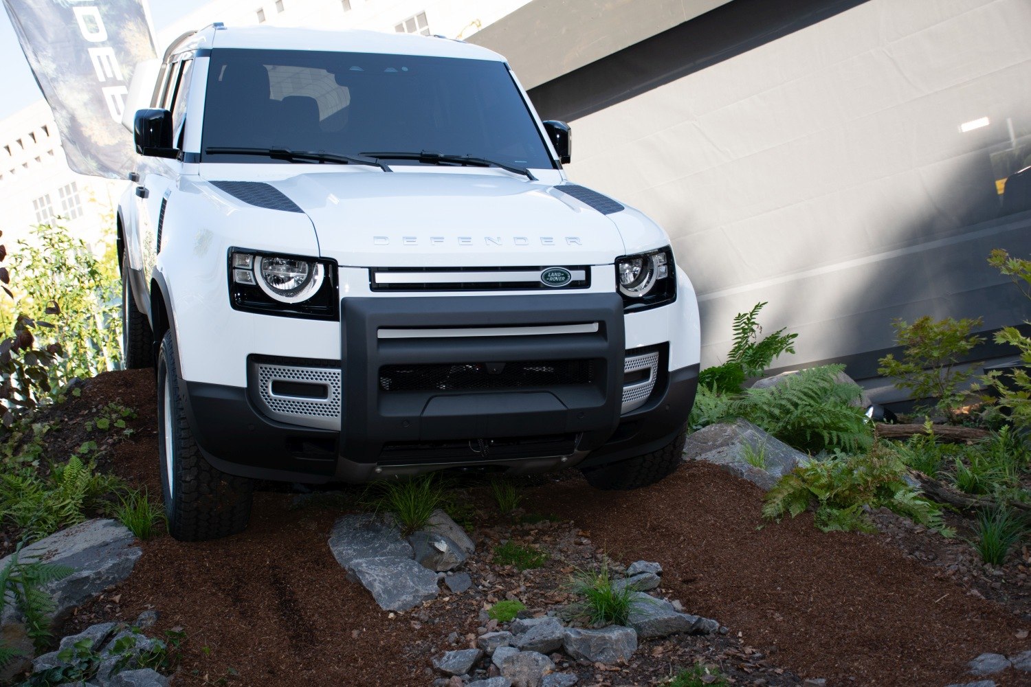 Front view of a white SUV with rugged off-road setup