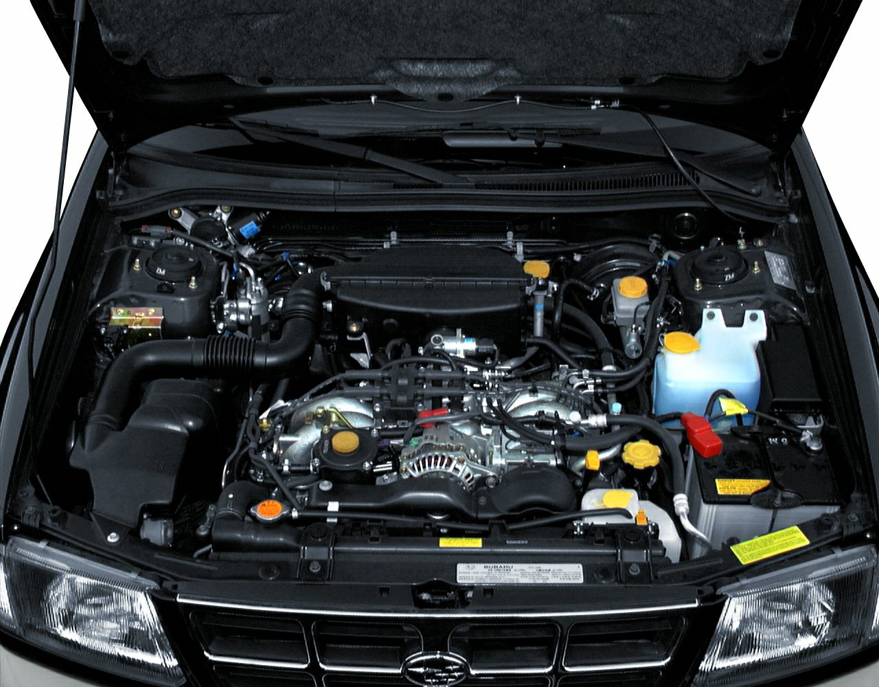 Open engine bay showing detailed layout with components and wiring.