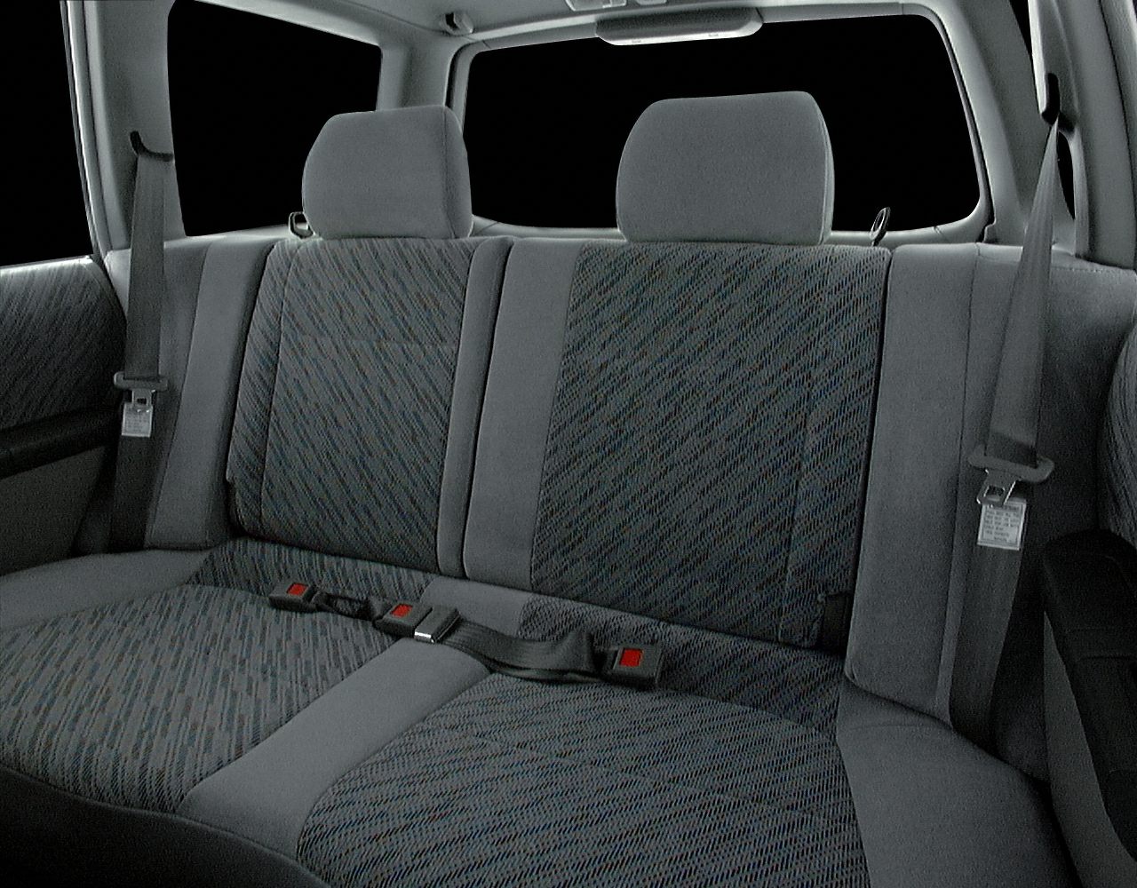 Rear seat with fabric upholstery and integrated headrests