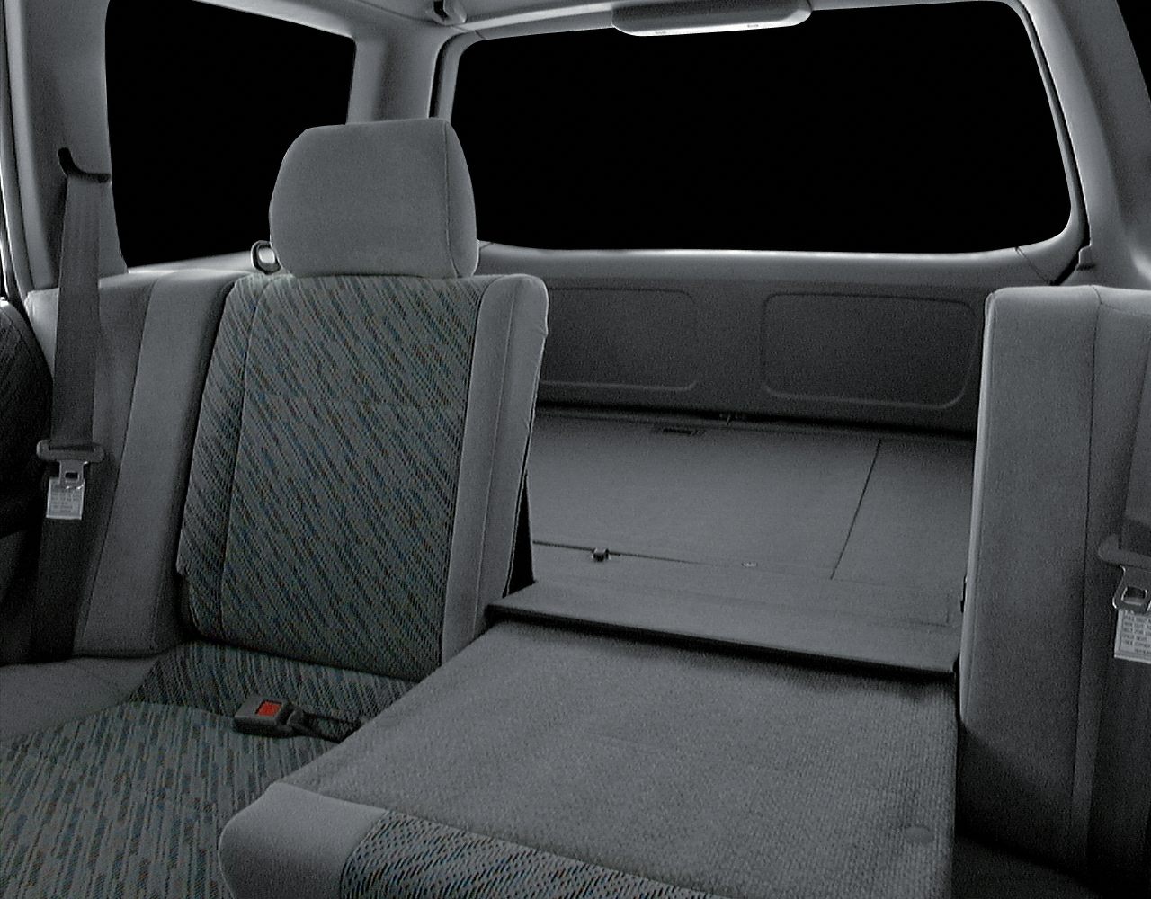 Rear seat and cargo space interior with foldable seatback