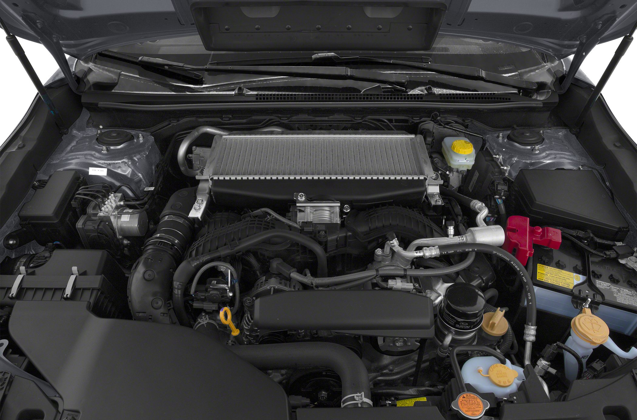 Top-mounted intercooler and turbocharged engine components under hood.