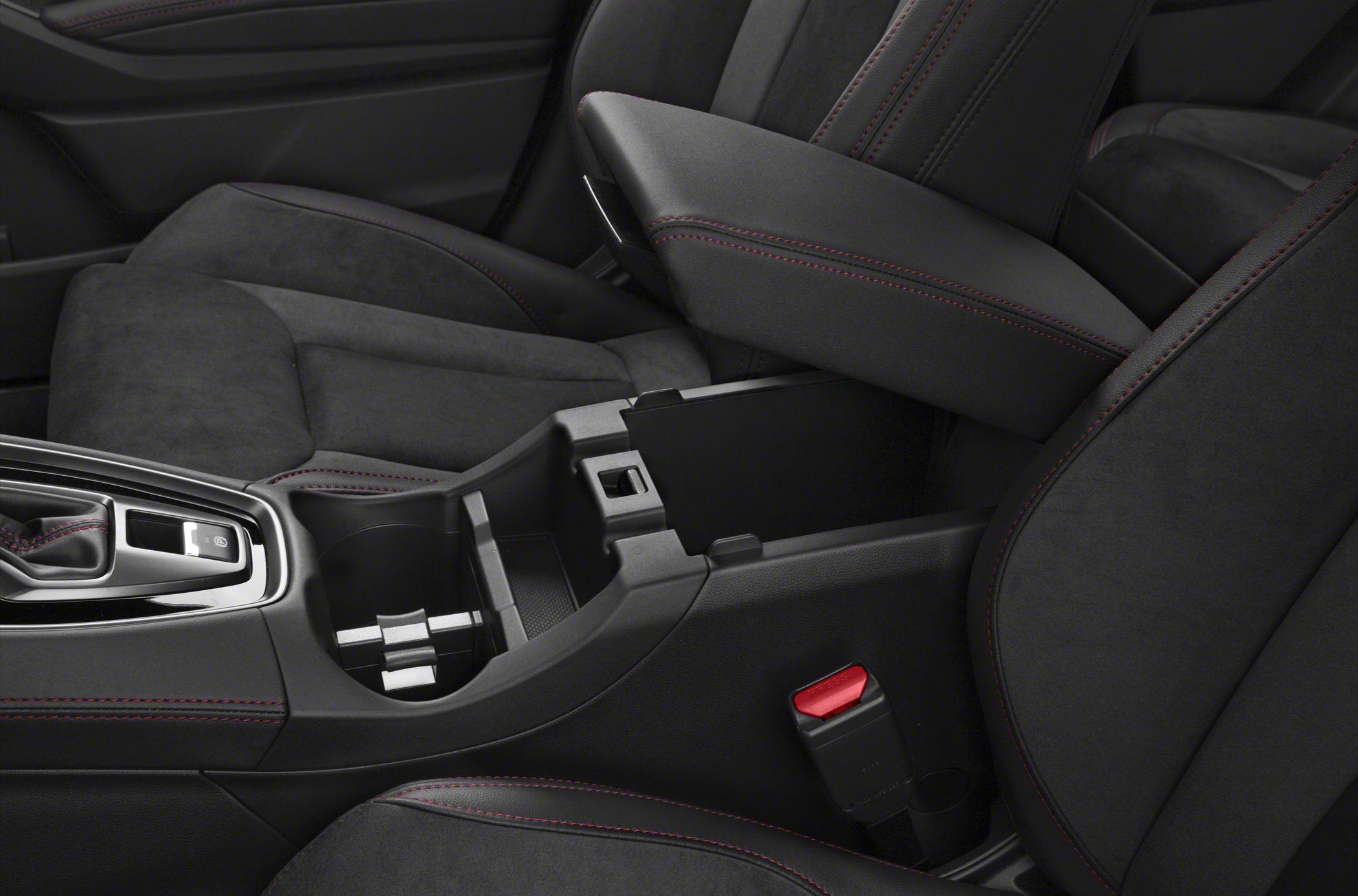 Center console with storage compartment and red-stitched armrest