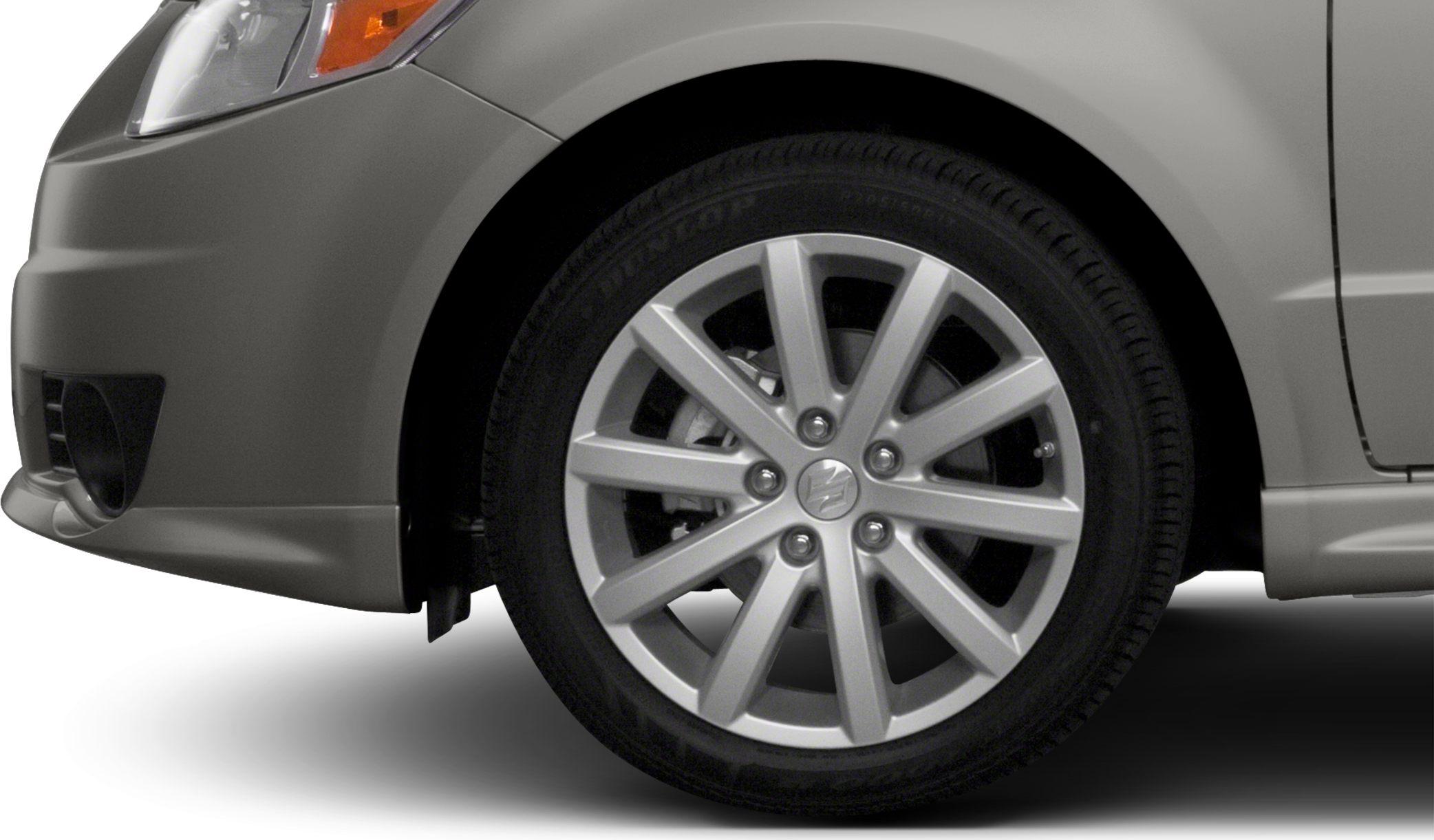 Silver multi-spoke alloy wheel and front fender detail on vehicle
