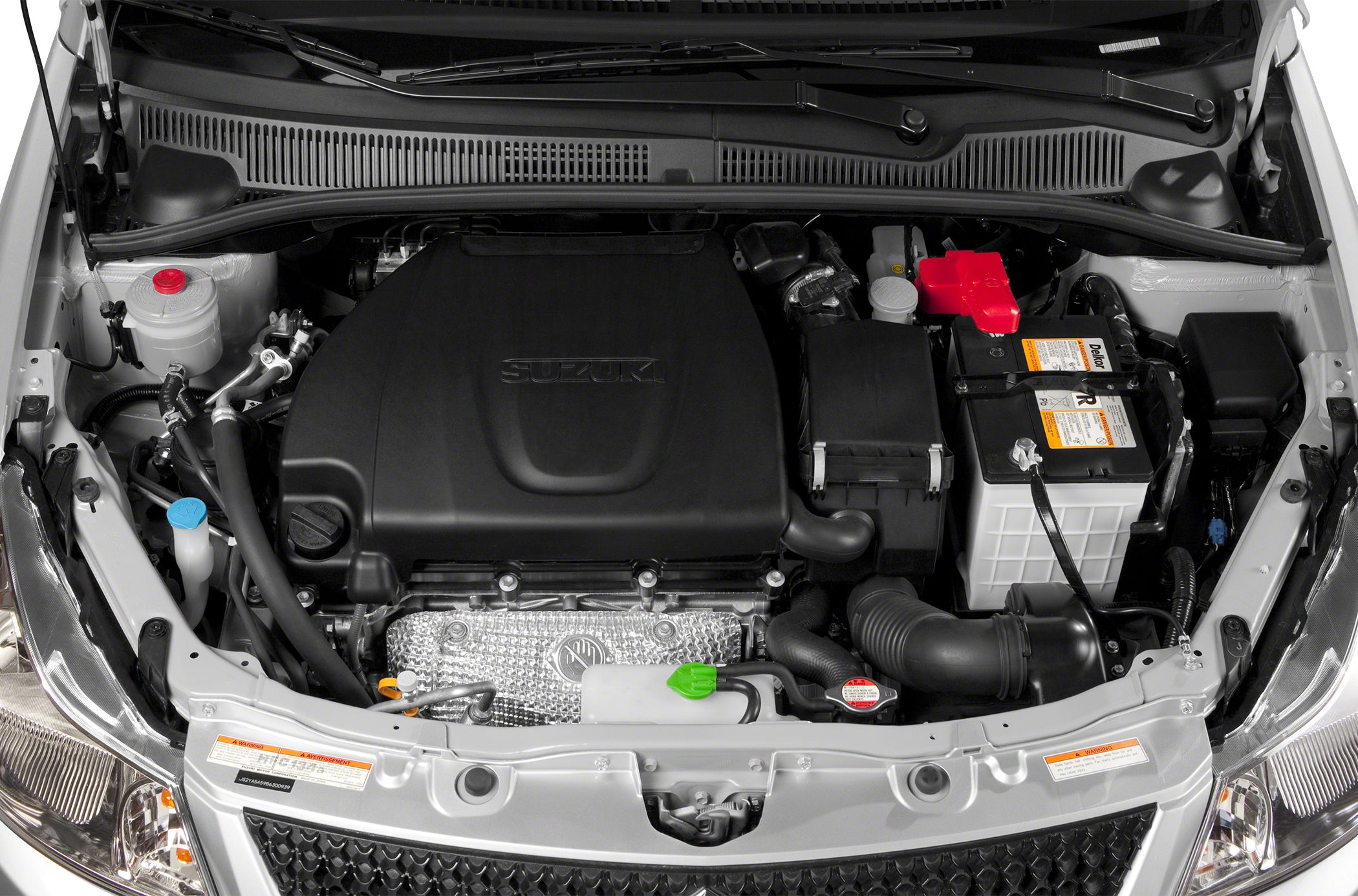 Engine bay with prominent engine cover and battery layout