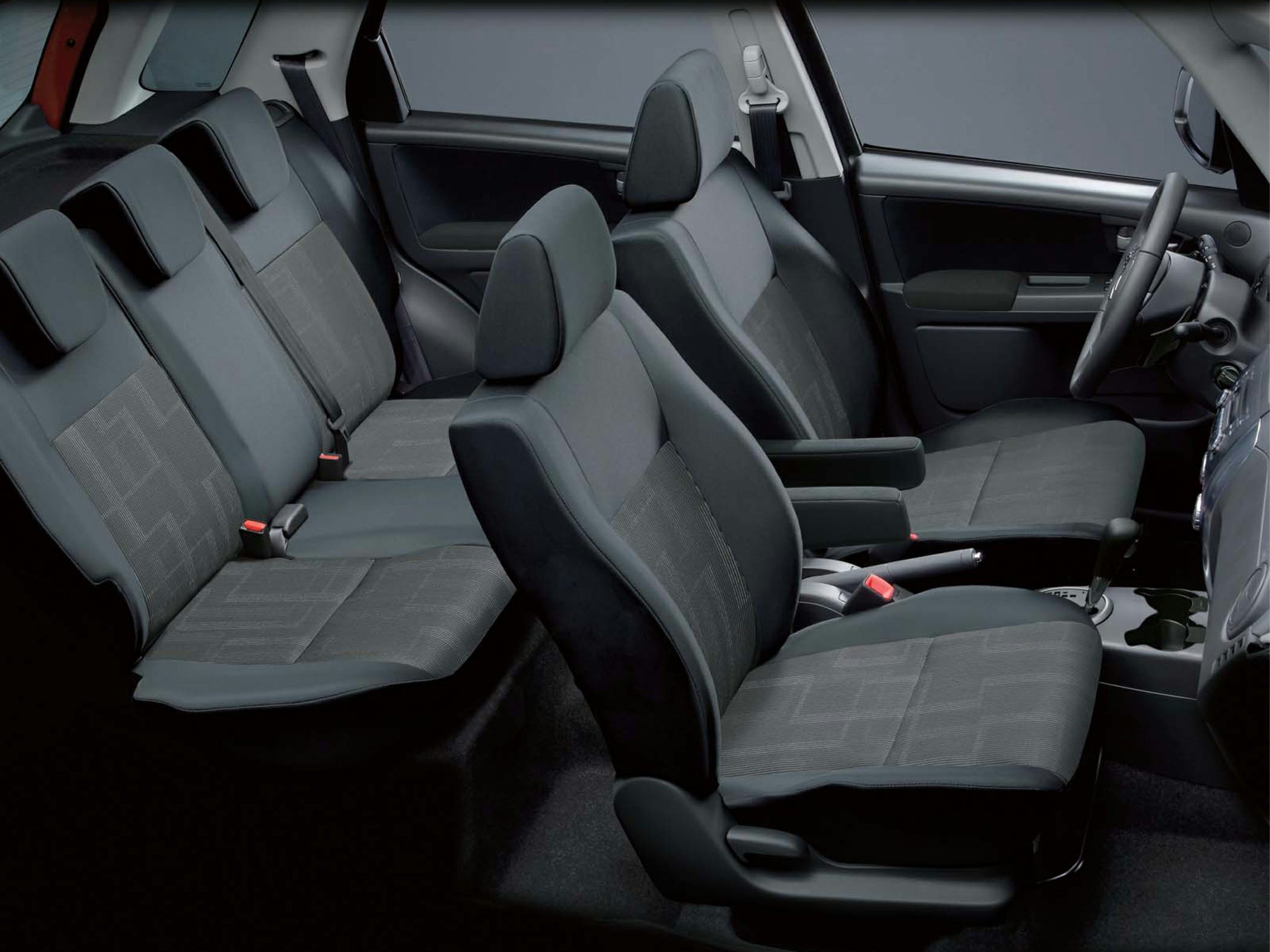 Front and rear fabric seats with patterned upholstery and adjustable headrests