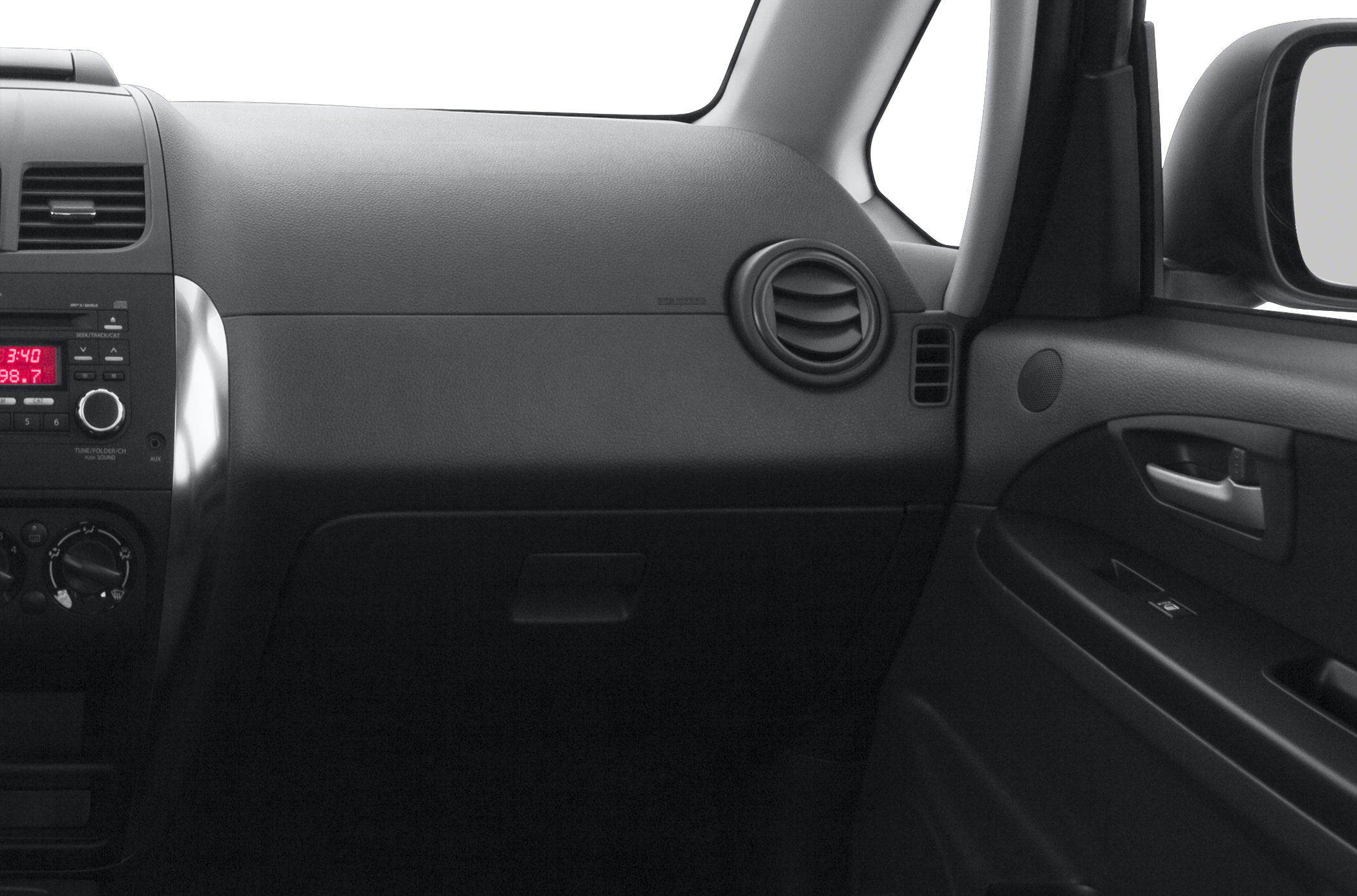 Car interior dashboard with circular air vent and audio controls