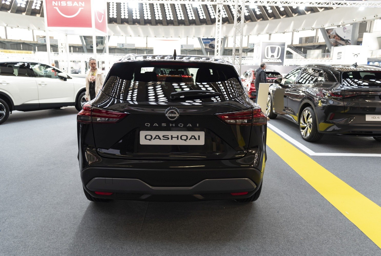 Rear view of a modern SUV with distinct taillights and rear windshield wiper