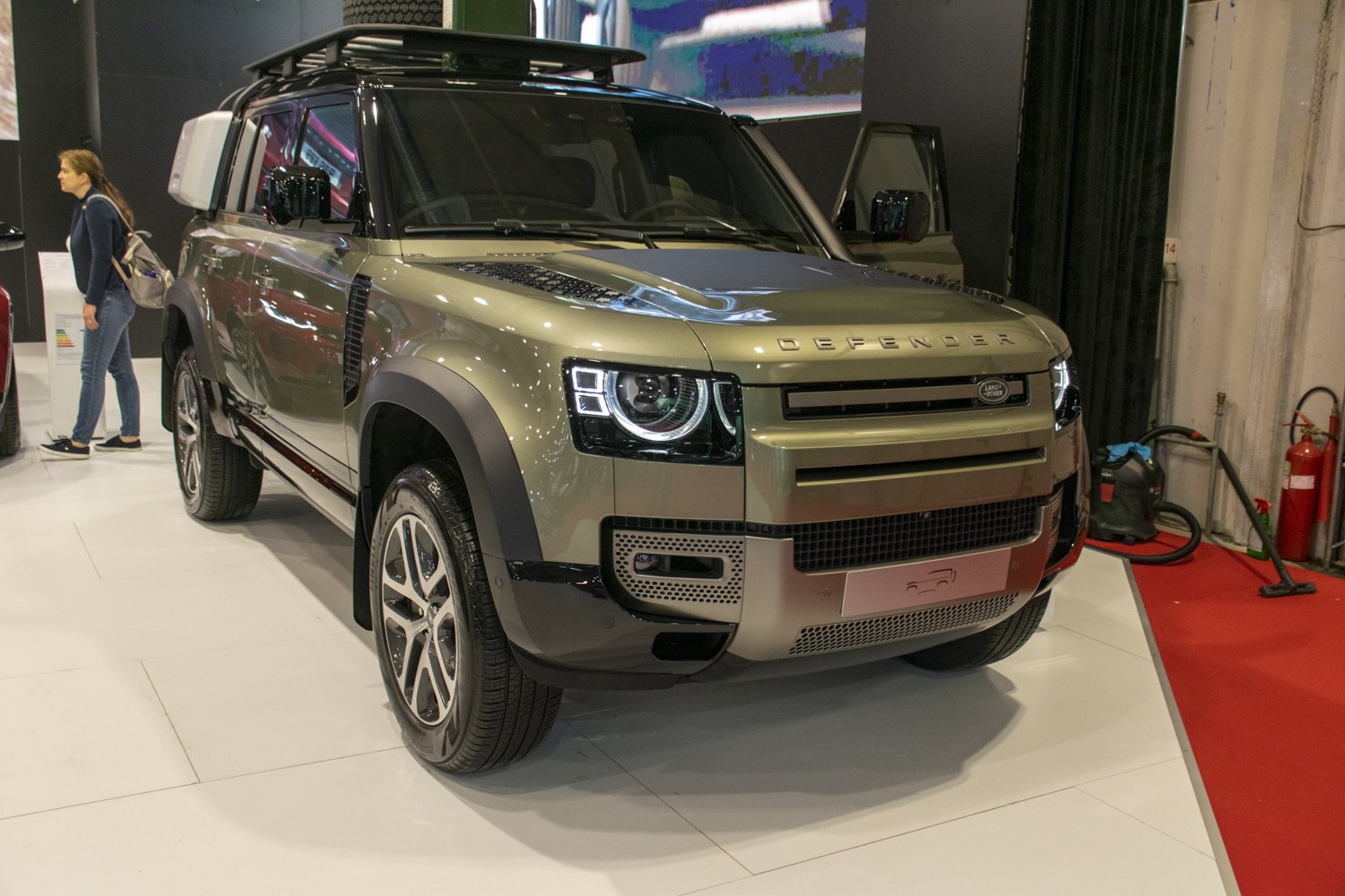 Front and side view of modern SUV with LED headlights and roof rack