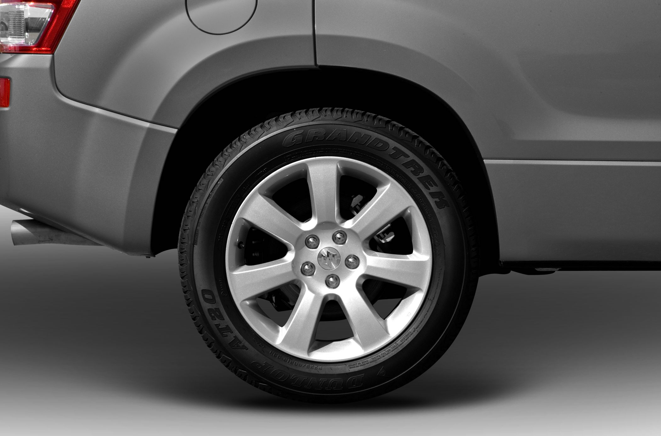 Alloy wheel and Dunlop Grandtrek tire close-up