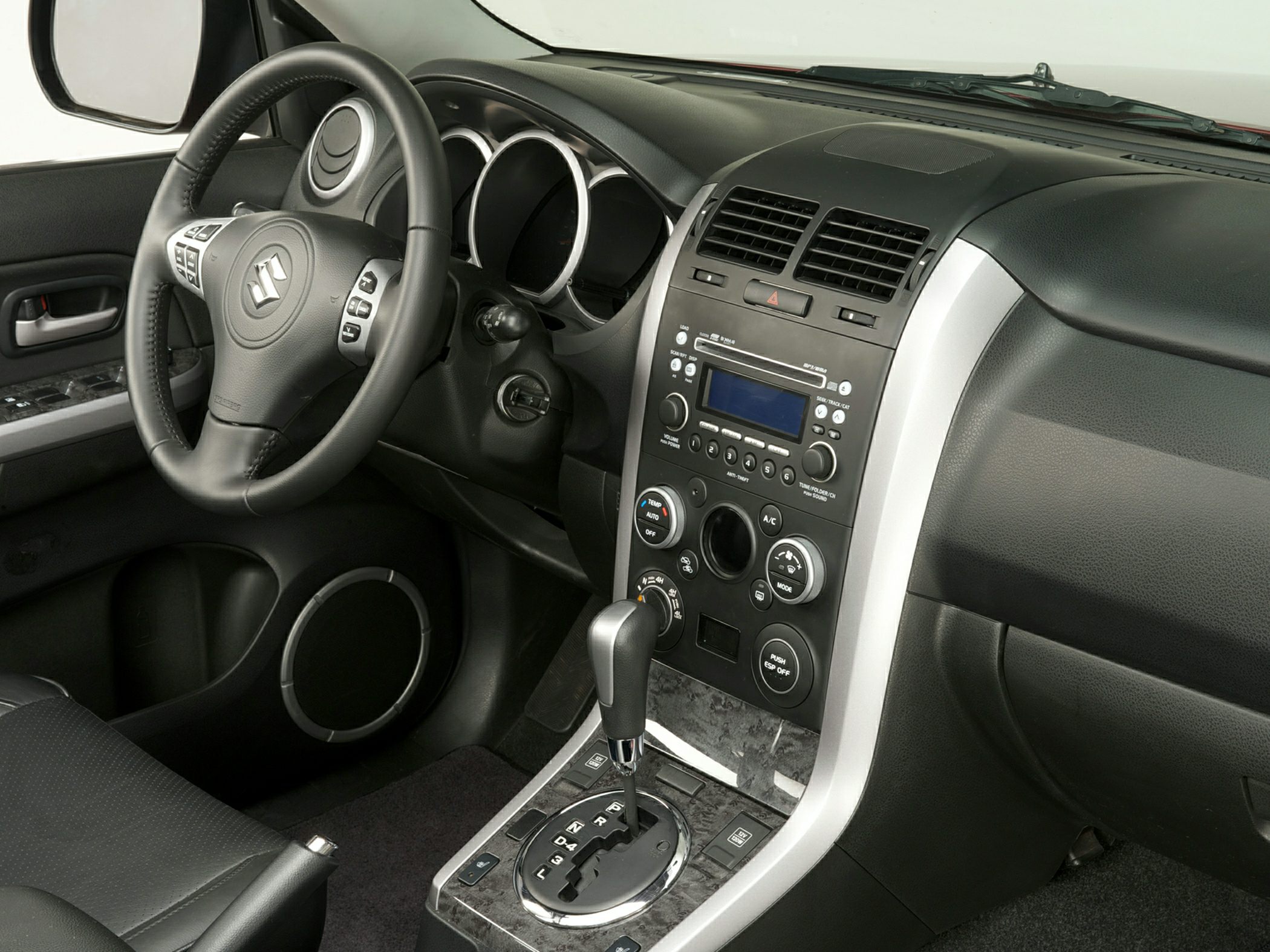 Automatic gear shift and dashboard with control panel and air conditioning knobs