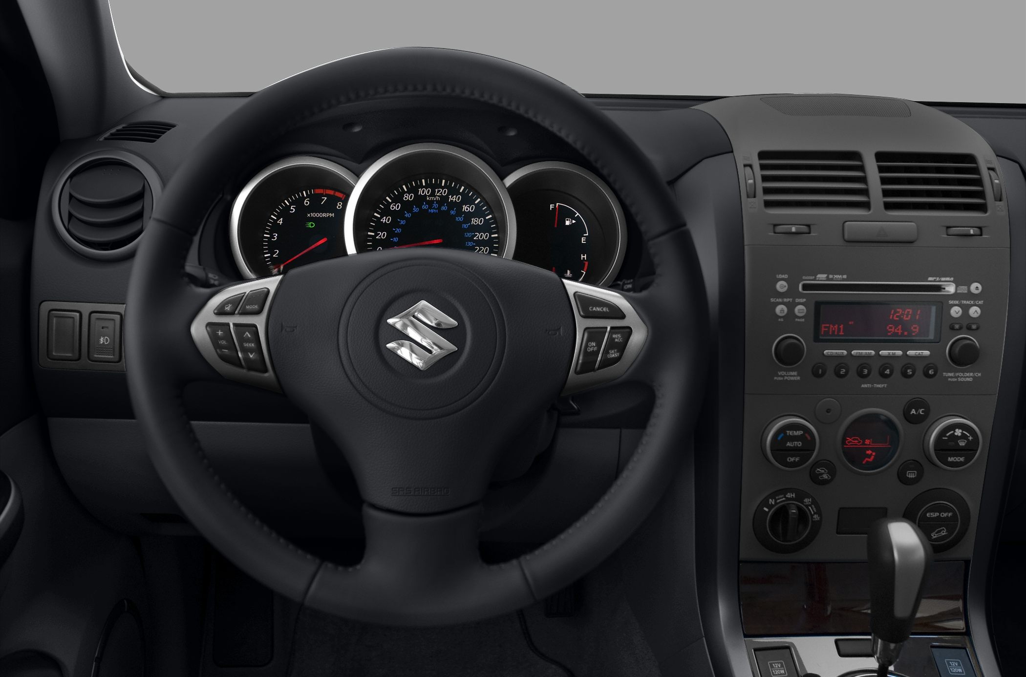 Steering wheel and dashboard with speedometer, controls, and radio panel